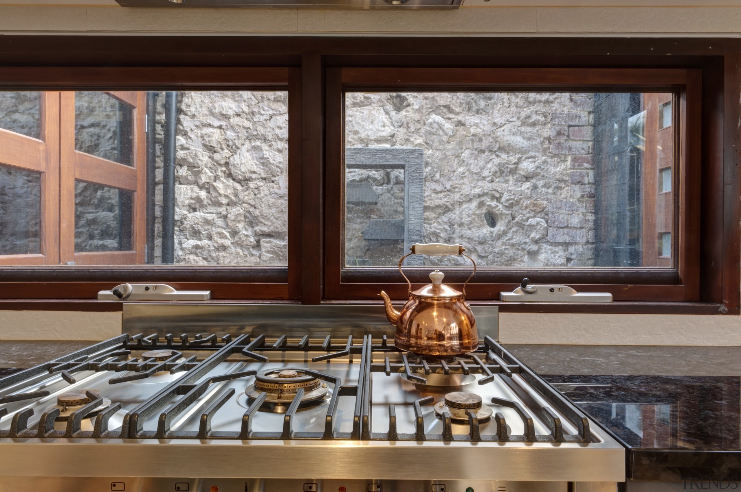 This kitchen window opens onto the back wall countertop, daylighting, interior design, window, gray, brown