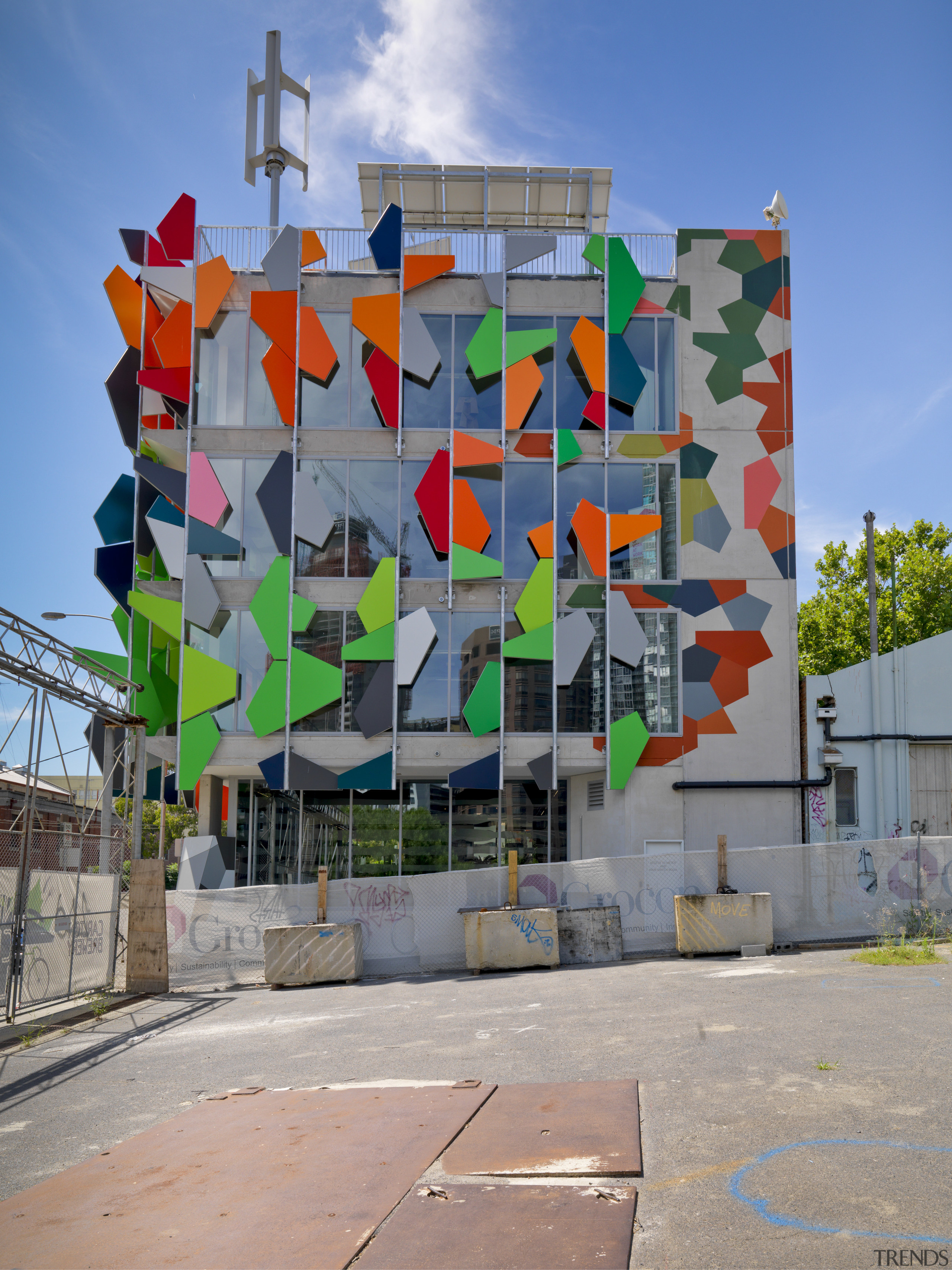 View of Pixel Building, with colorful exterior flags, architecture, art, building, facade, graffiti, mural, neighbourhood, wall, gray, teal