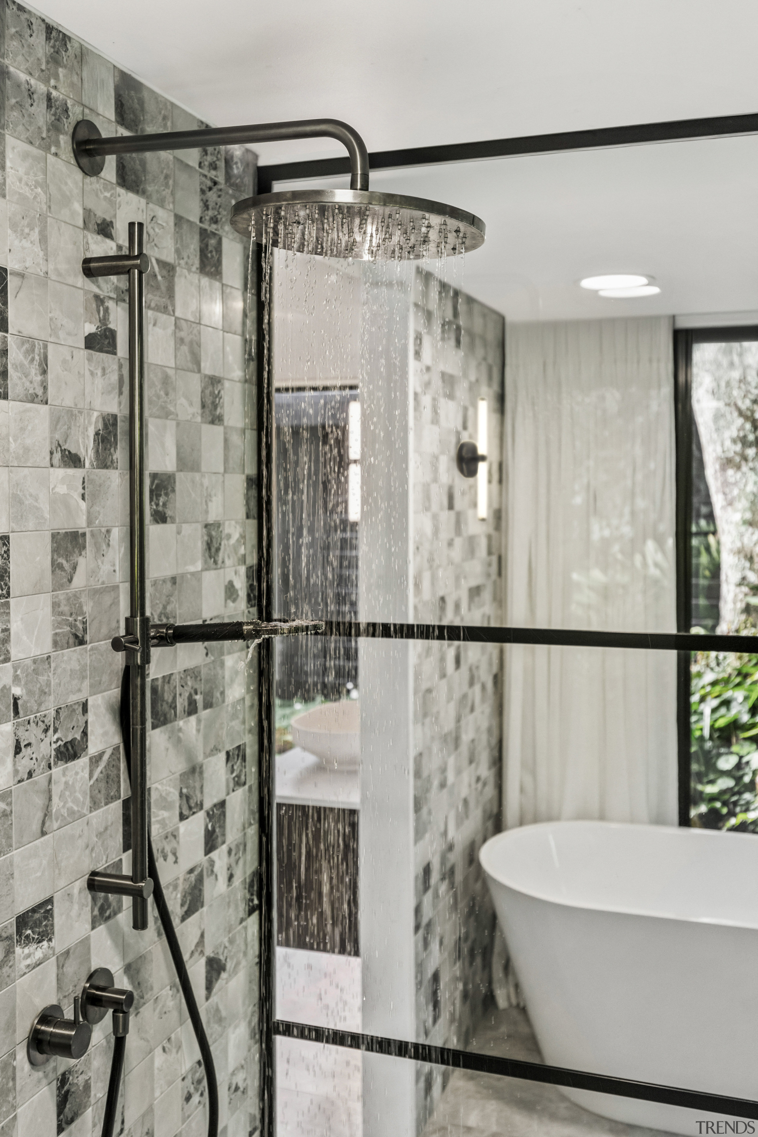 Shower enclosure detail showing the mosaic wall finish 
