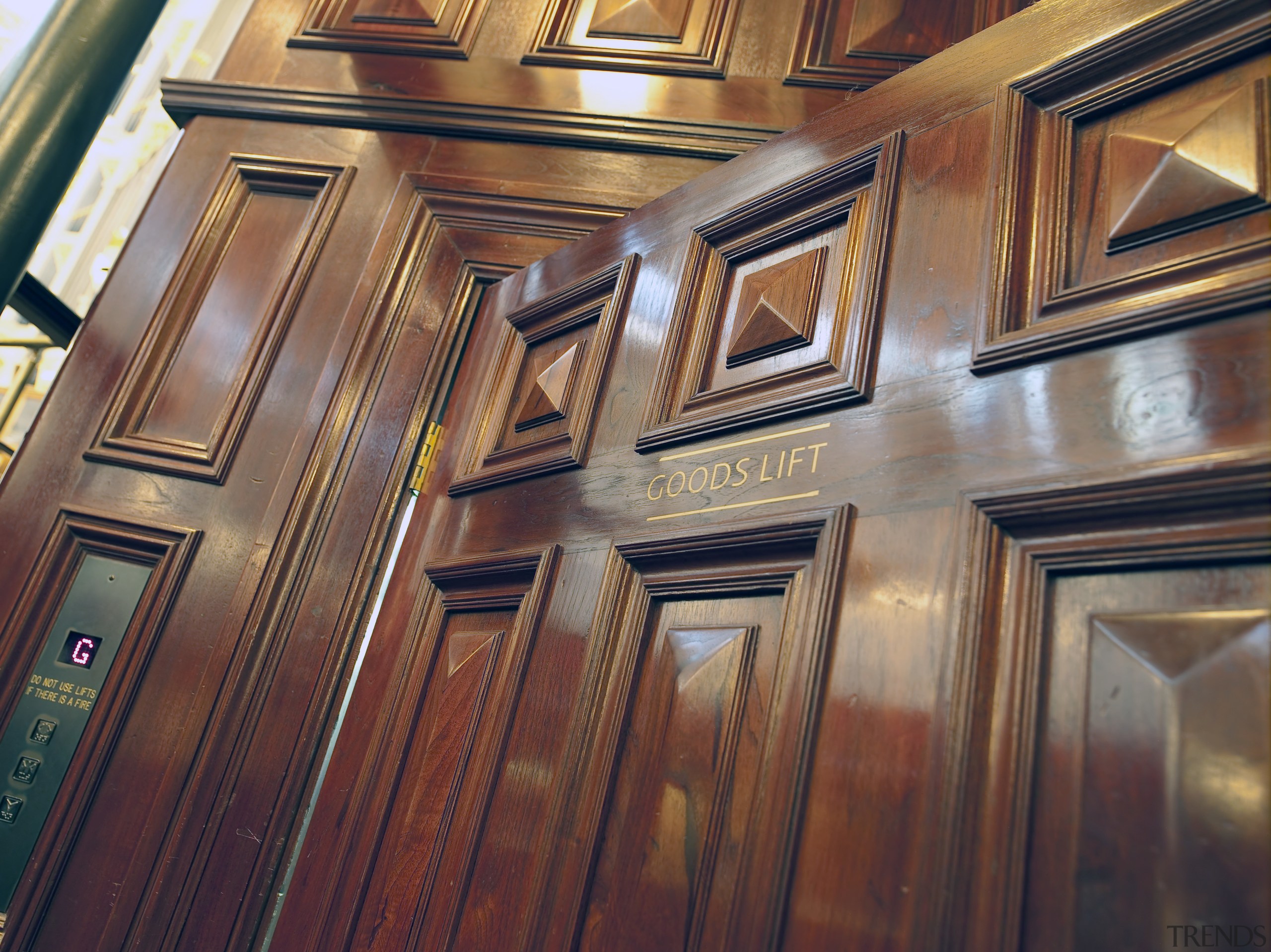 View of lifts in the renovated historic Sydney door, wall, window, wood, wood stain, brown