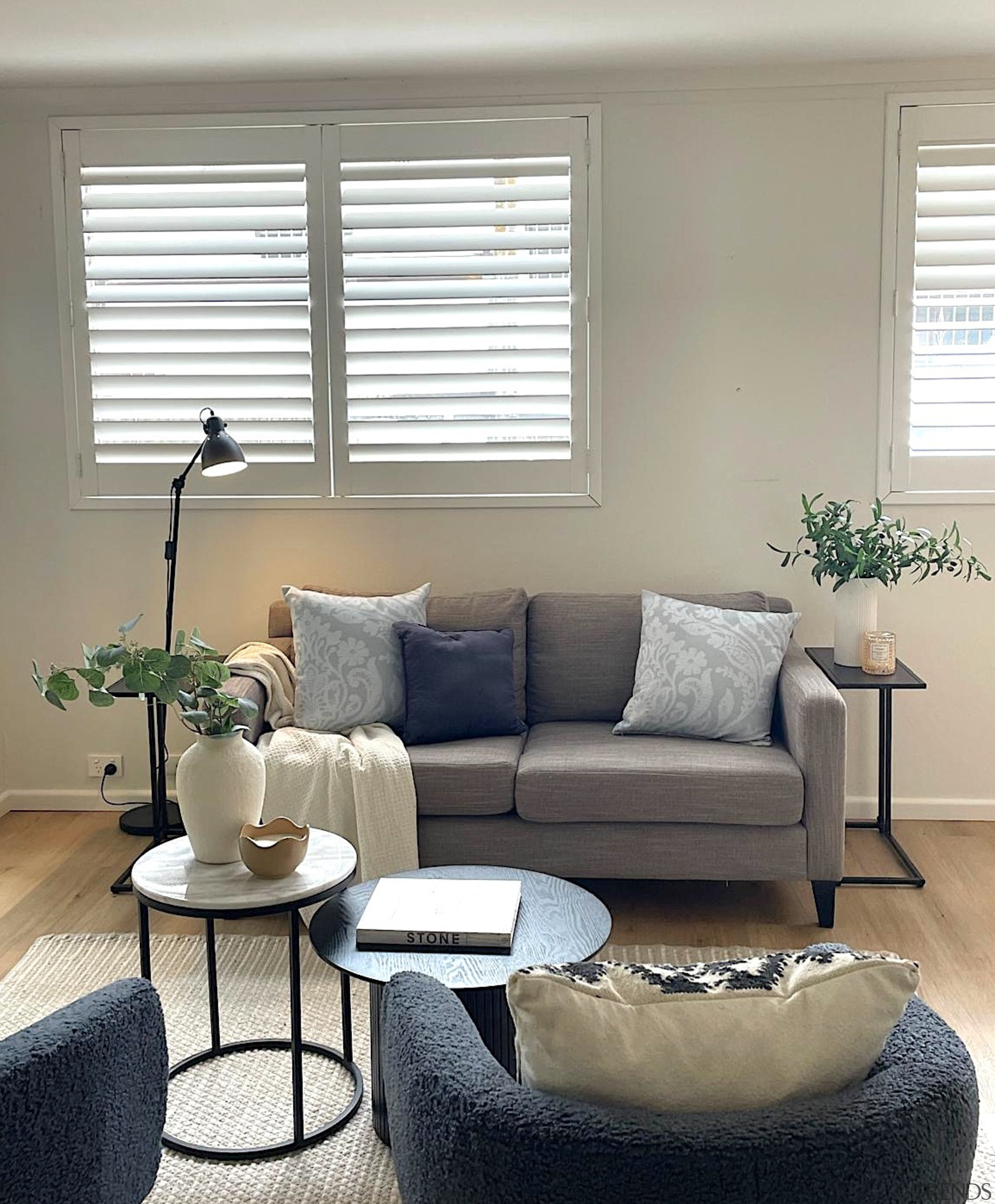 Introduce subtle contrast through textures like boucle, rattan, 