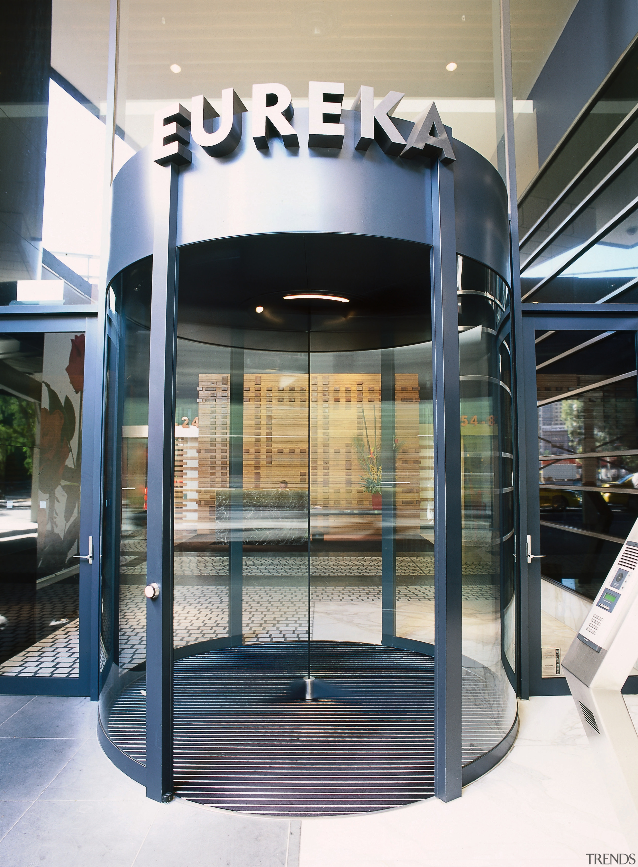 view of the entrance to eureka towe featuring door, glass, white, black