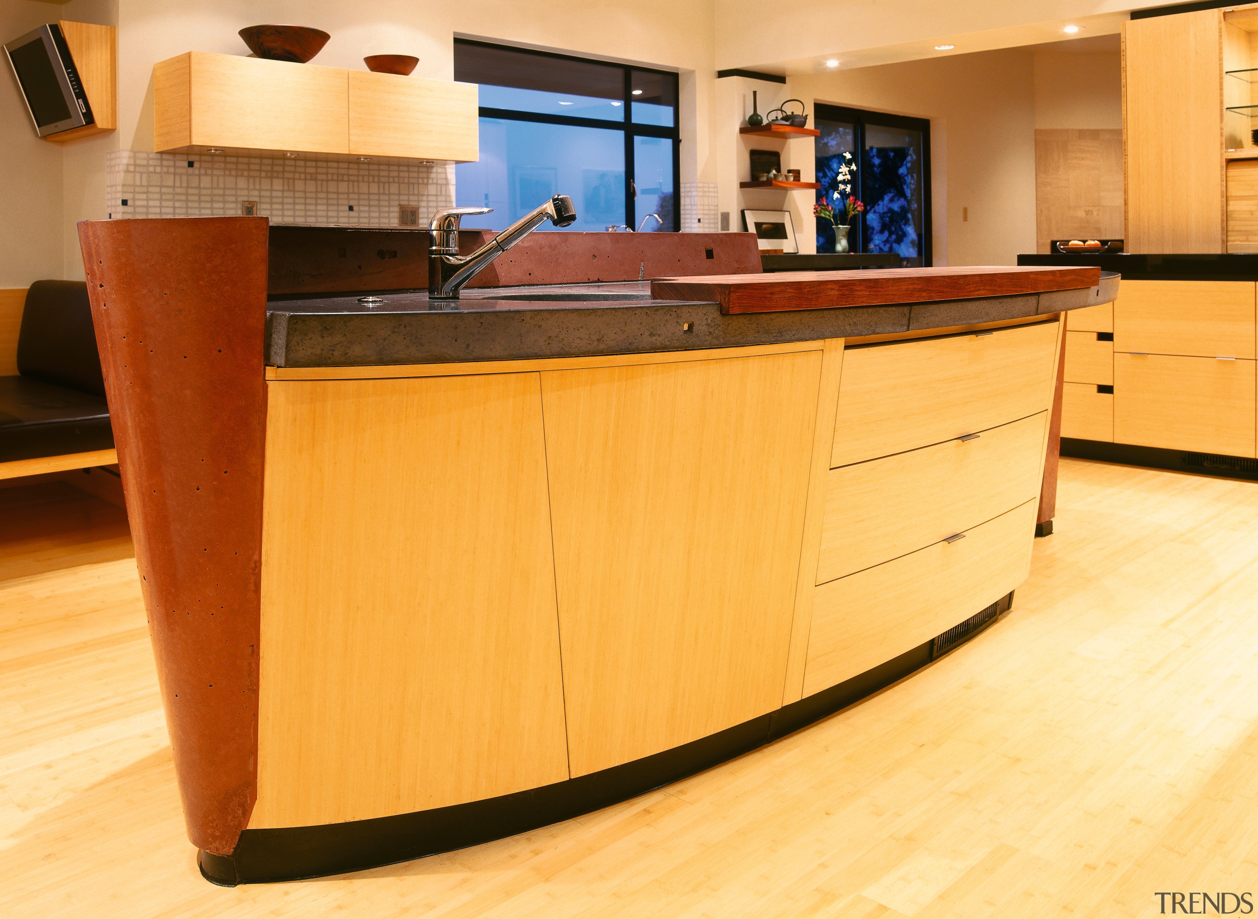 A view of a kitchen, wooden flooring and cabinetry, countertop, floor, flooring, furniture, hardwood, interior design, kitchen, wood, wood flooring, wood stain, orange, brown