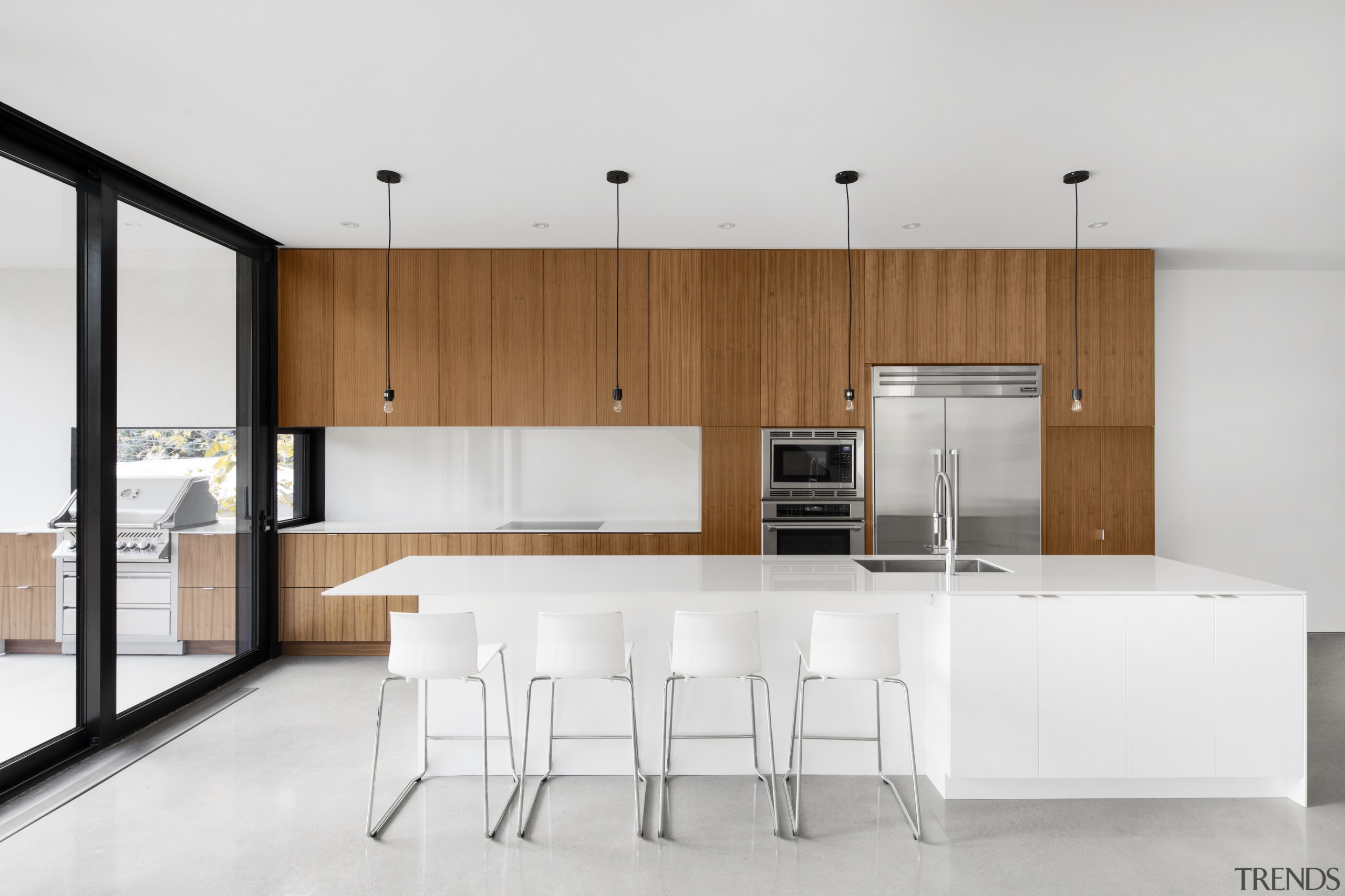 The perimeter kitchen counter naturally flows out onto 