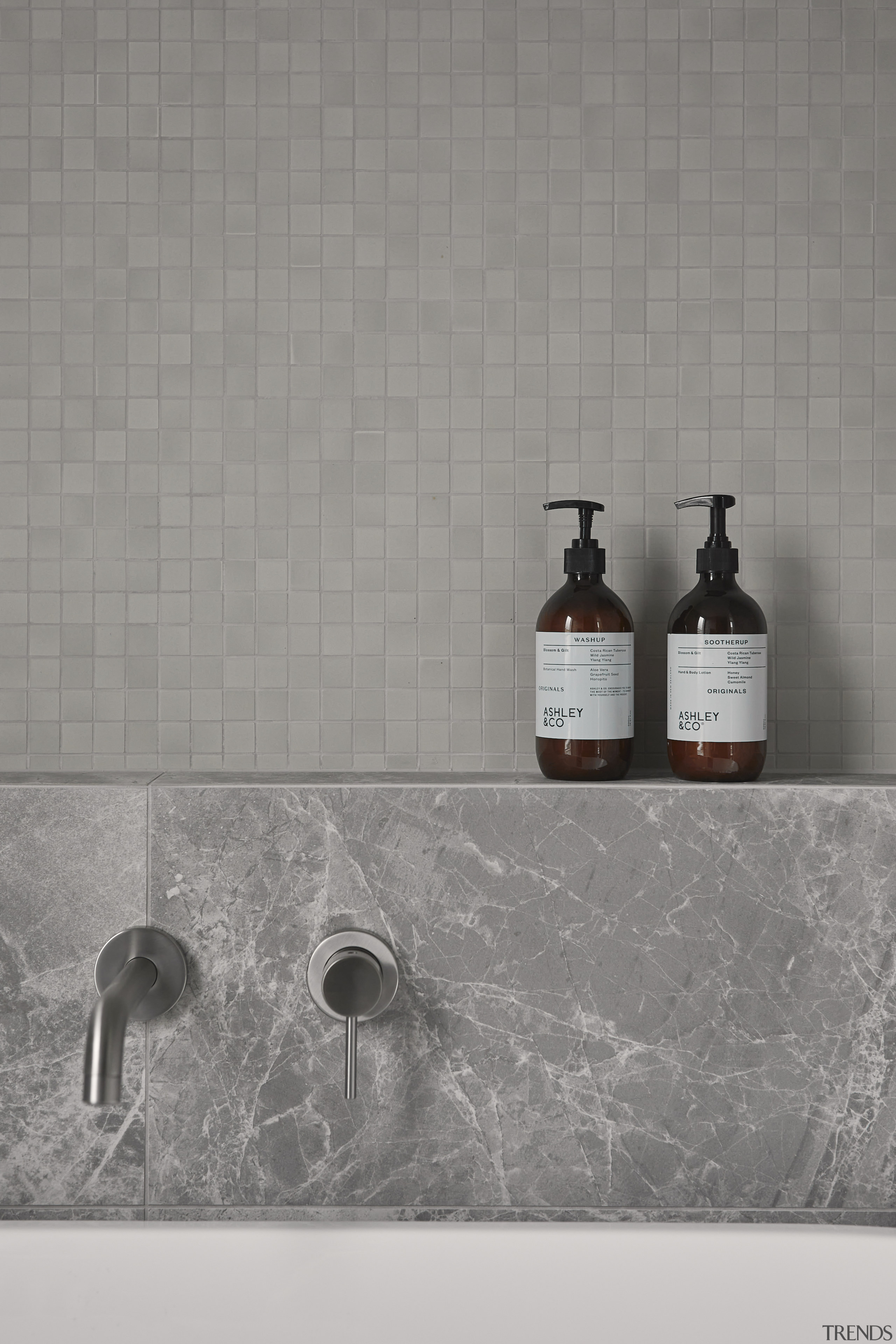 Tap and bath surround detail. - Flair and 