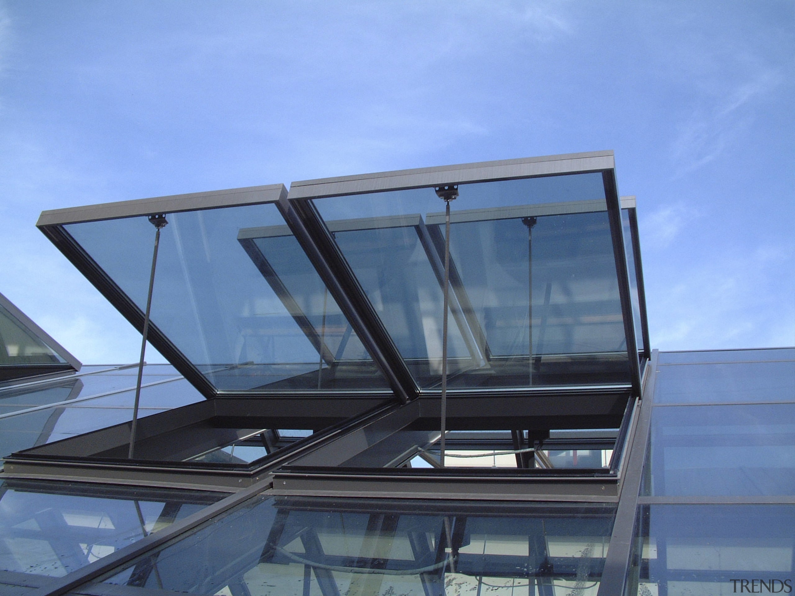 Low angle shot of open windows. - Low architecture, automotive exterior, daylighting, glass, roof, sky, window, teal