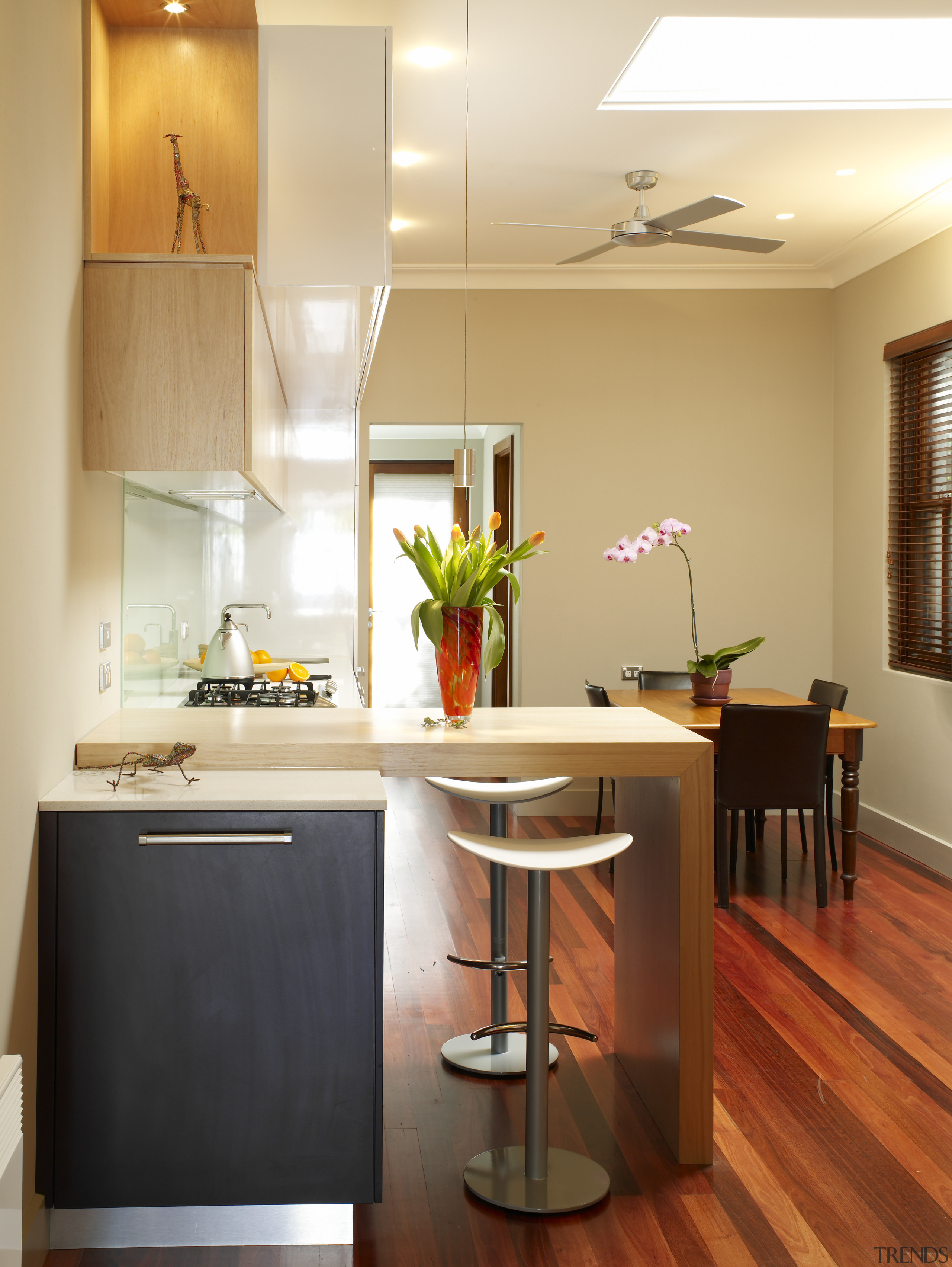 A view of the kitchen, wooden flooring, cabinetry, cabinetry, countertop, cuisine classique, floor, hardwood, home, interior design, kitchen, room, table, wood flooring, orange