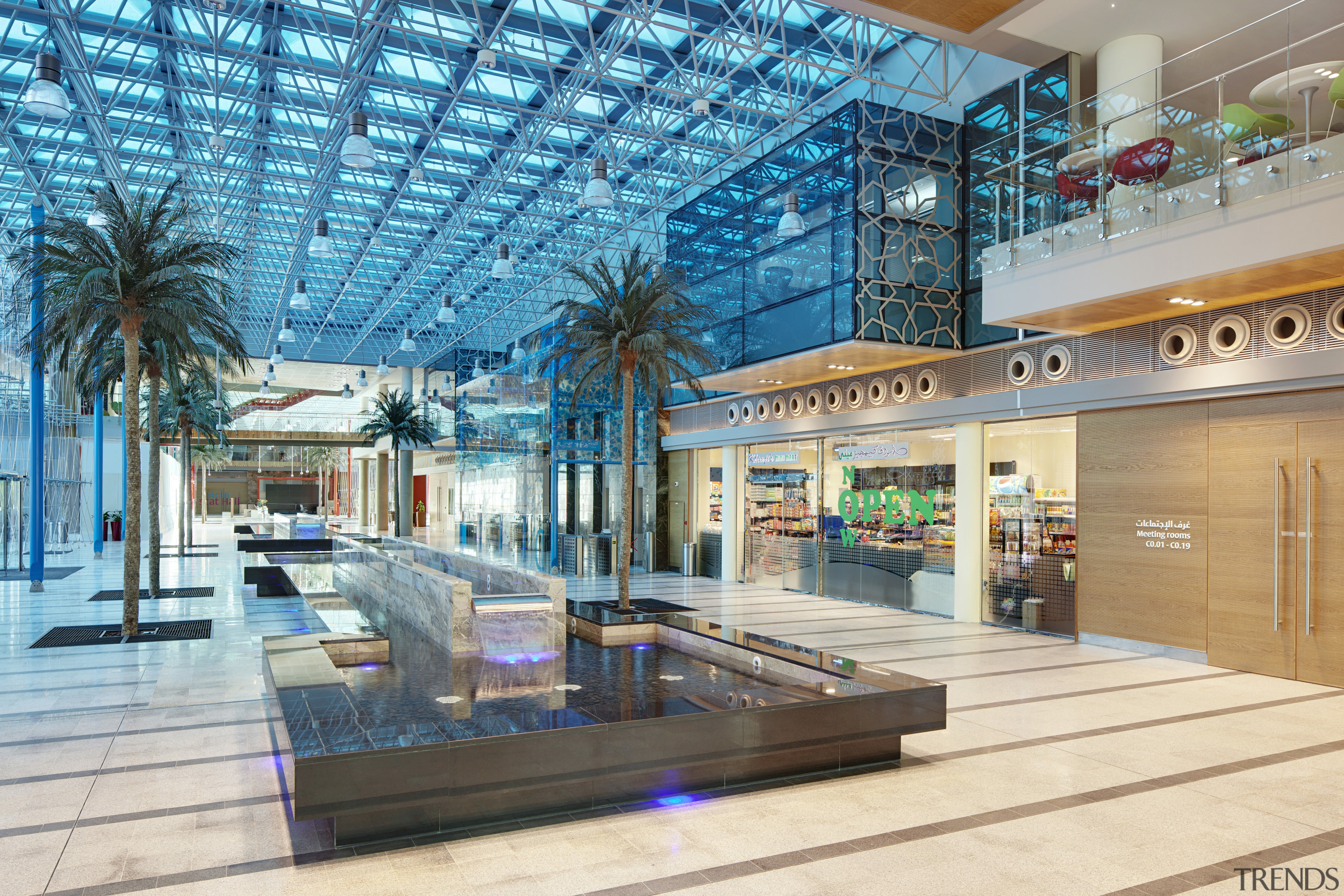 View of interior with palms and turquoise lighting. interior design, leisure, lobby, shopping mall, teal