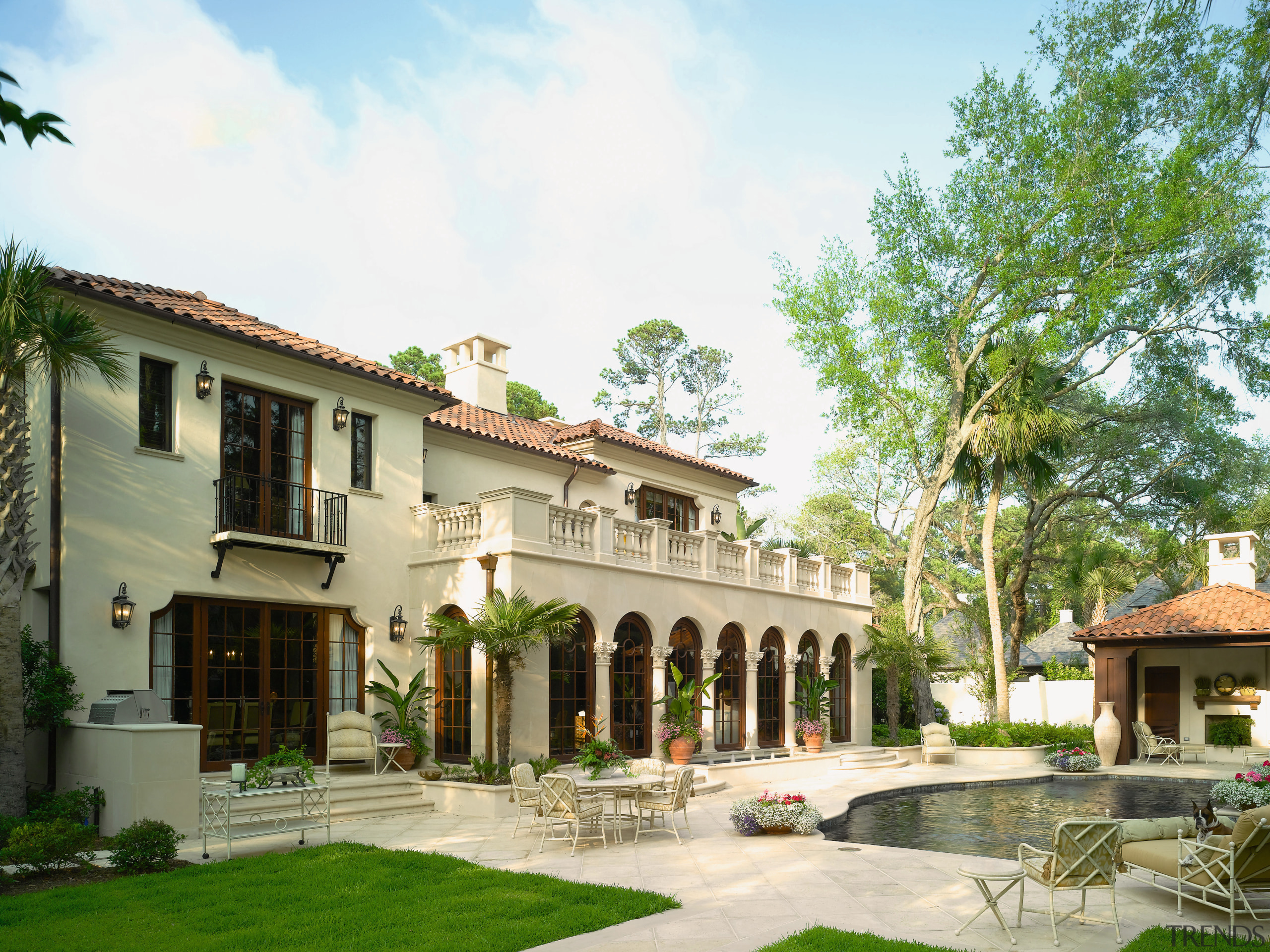 Exterior view of house where the architecture was courtyard, estate, hacienda, home, house, mansion, official residence, property, real estate, residential area, resort, villa, white