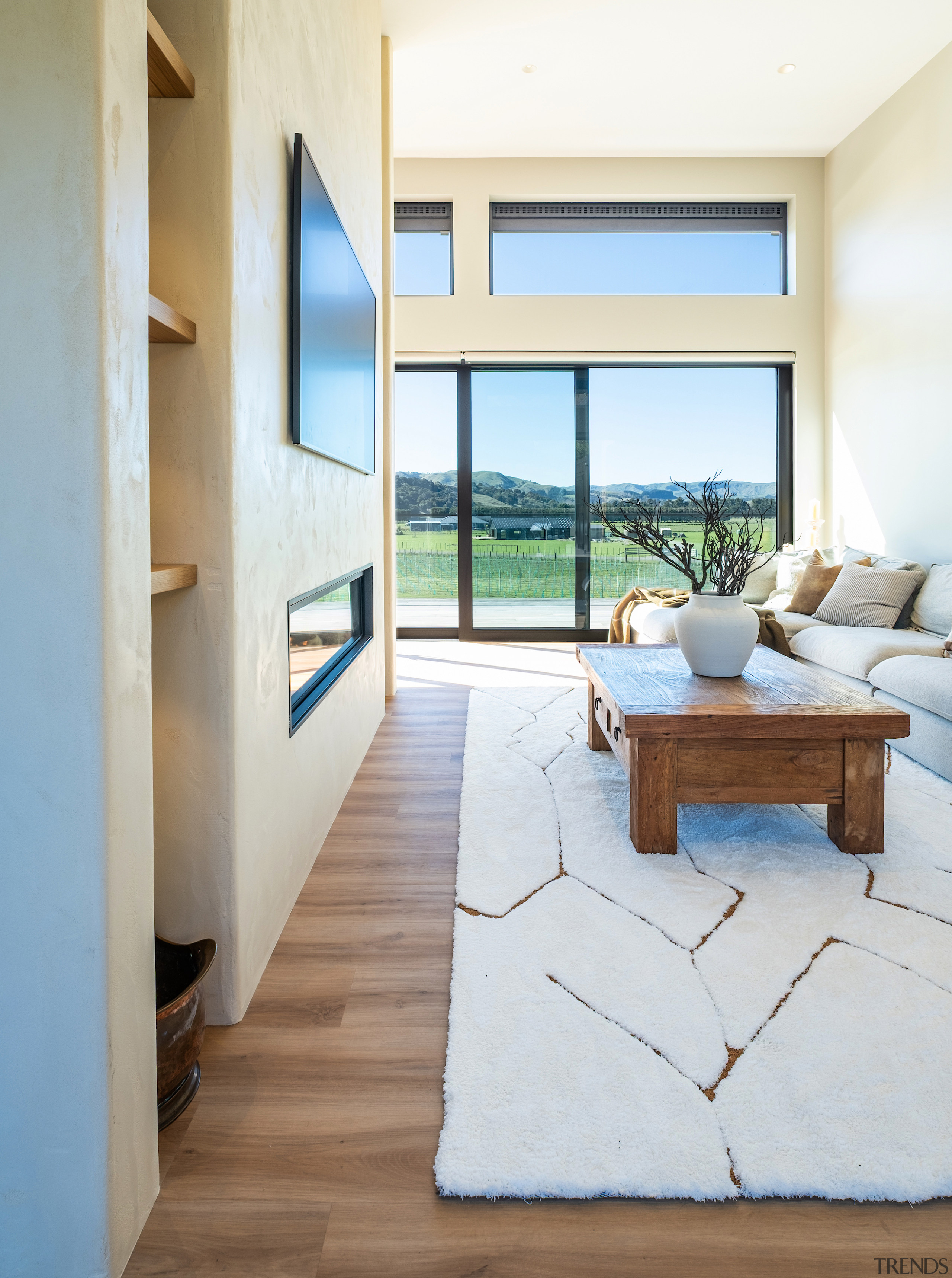 Living area showing stacking sliders and clerestory windows 
