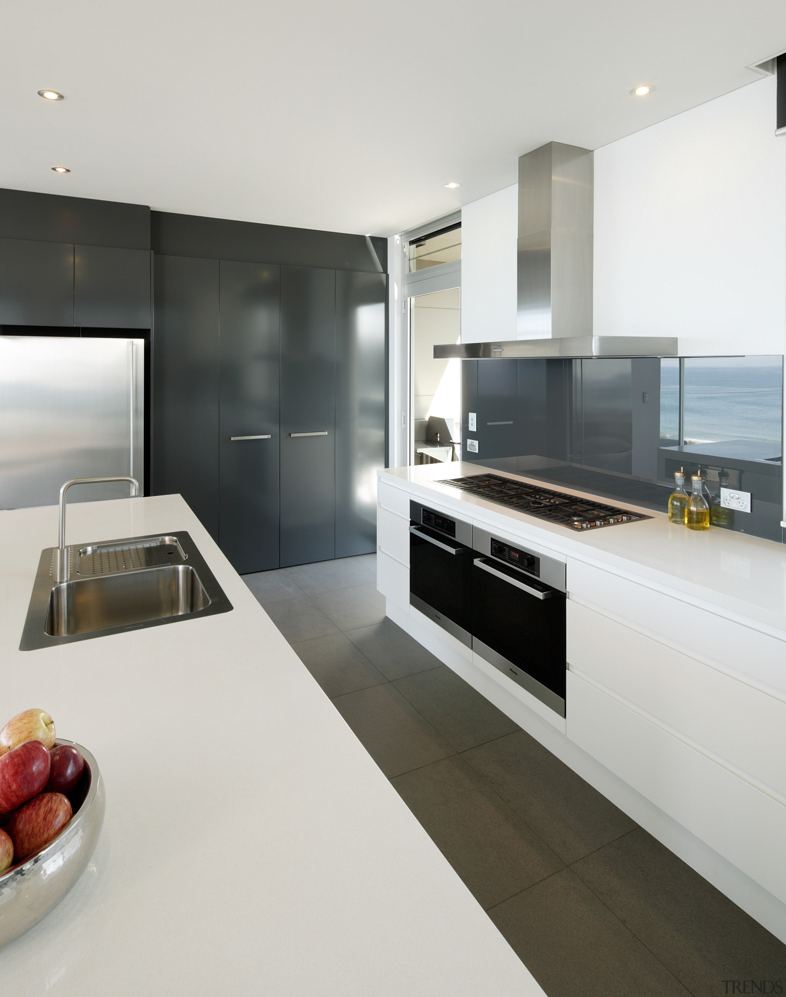 View of kitchen and dining area  designed countertop, interior design, kitchen, white