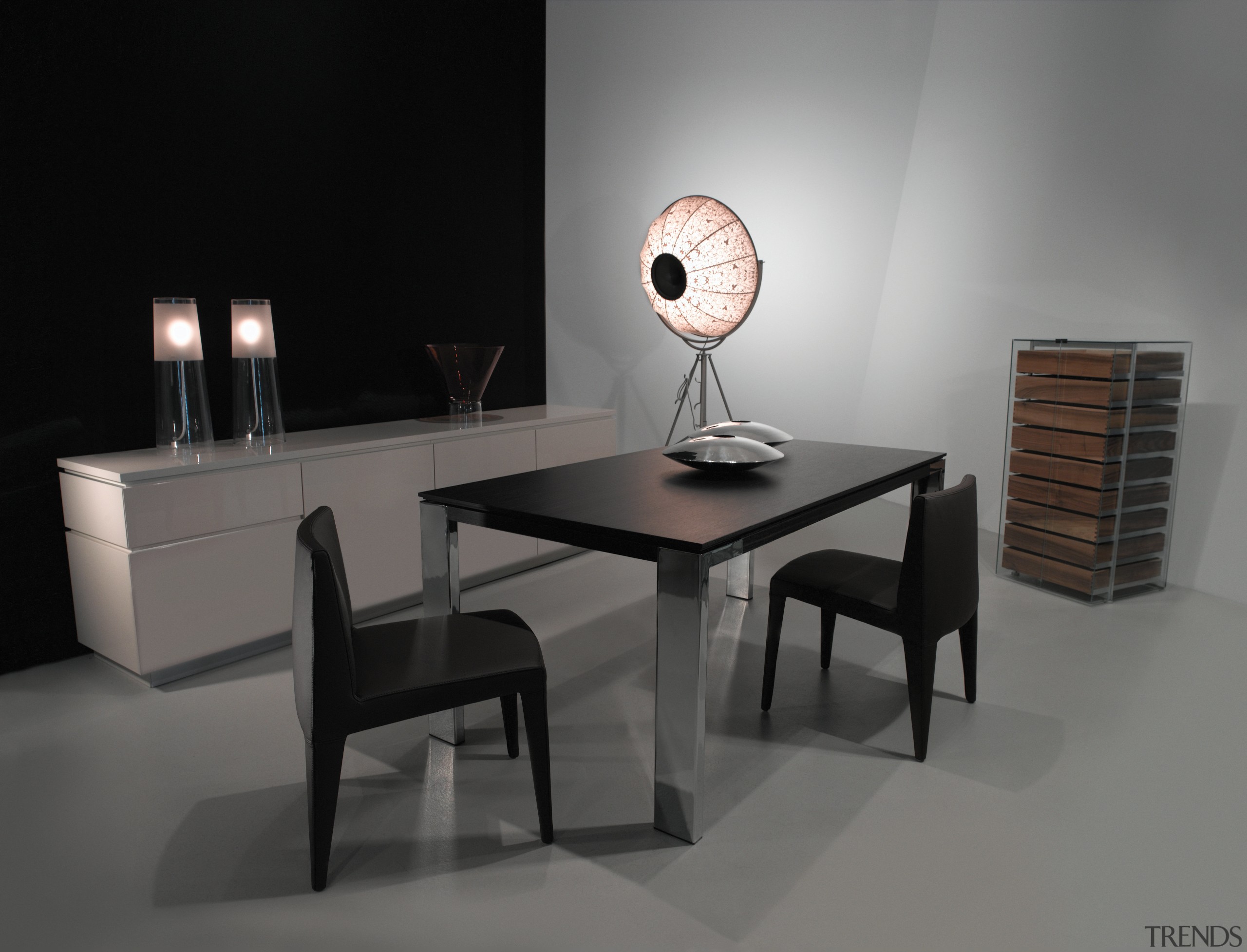 View of black dining table and chairs with chair, coffee table, desk, furniture, interior design, product design, still life photography, table, gray, black