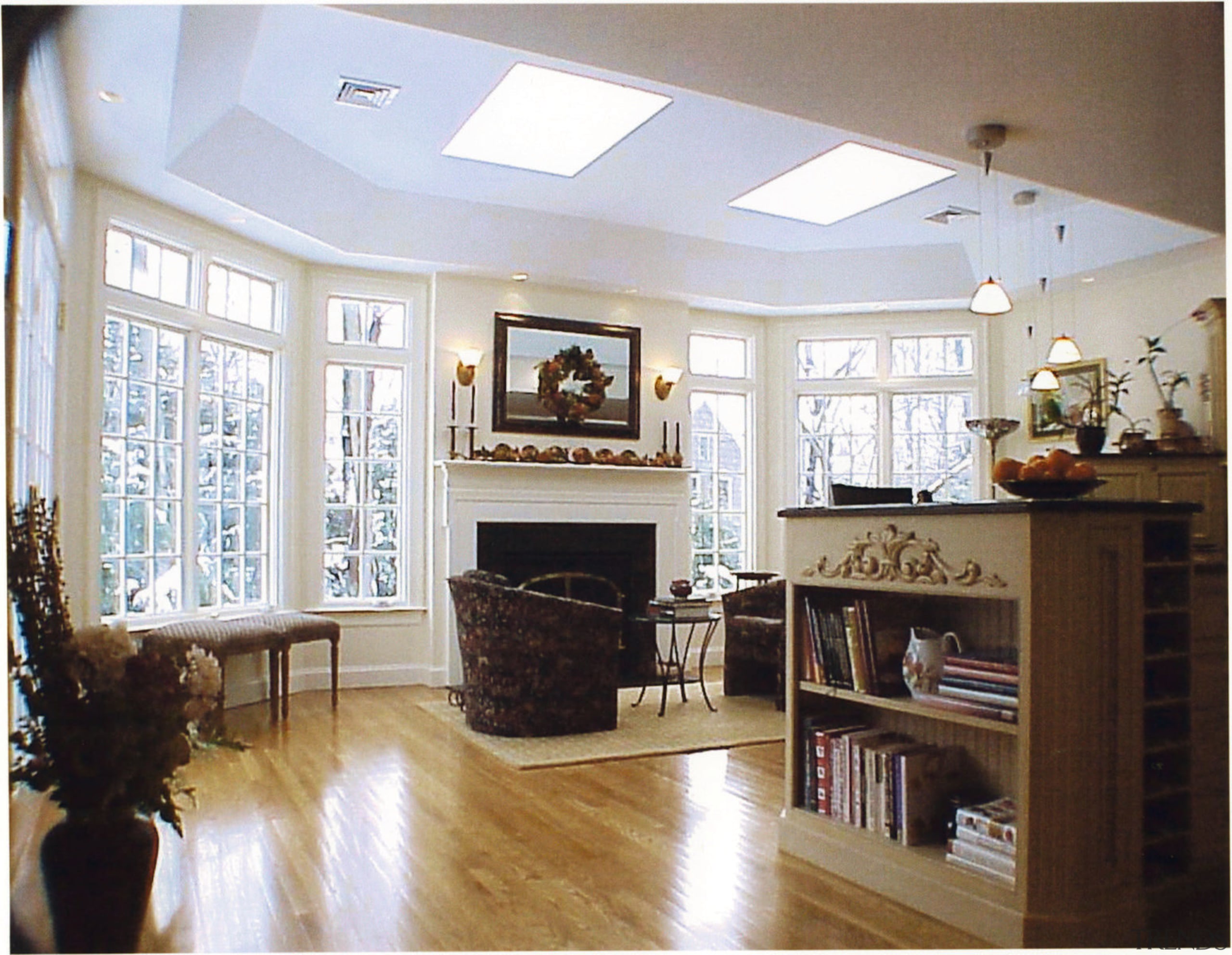 View of a living area, wooden flooring, large cabinetry, ceiling, floor, flooring, furniture, hardwood, home, interior design, kitchen, living room, room, shelving, wall, window, wood, wood flooring, white