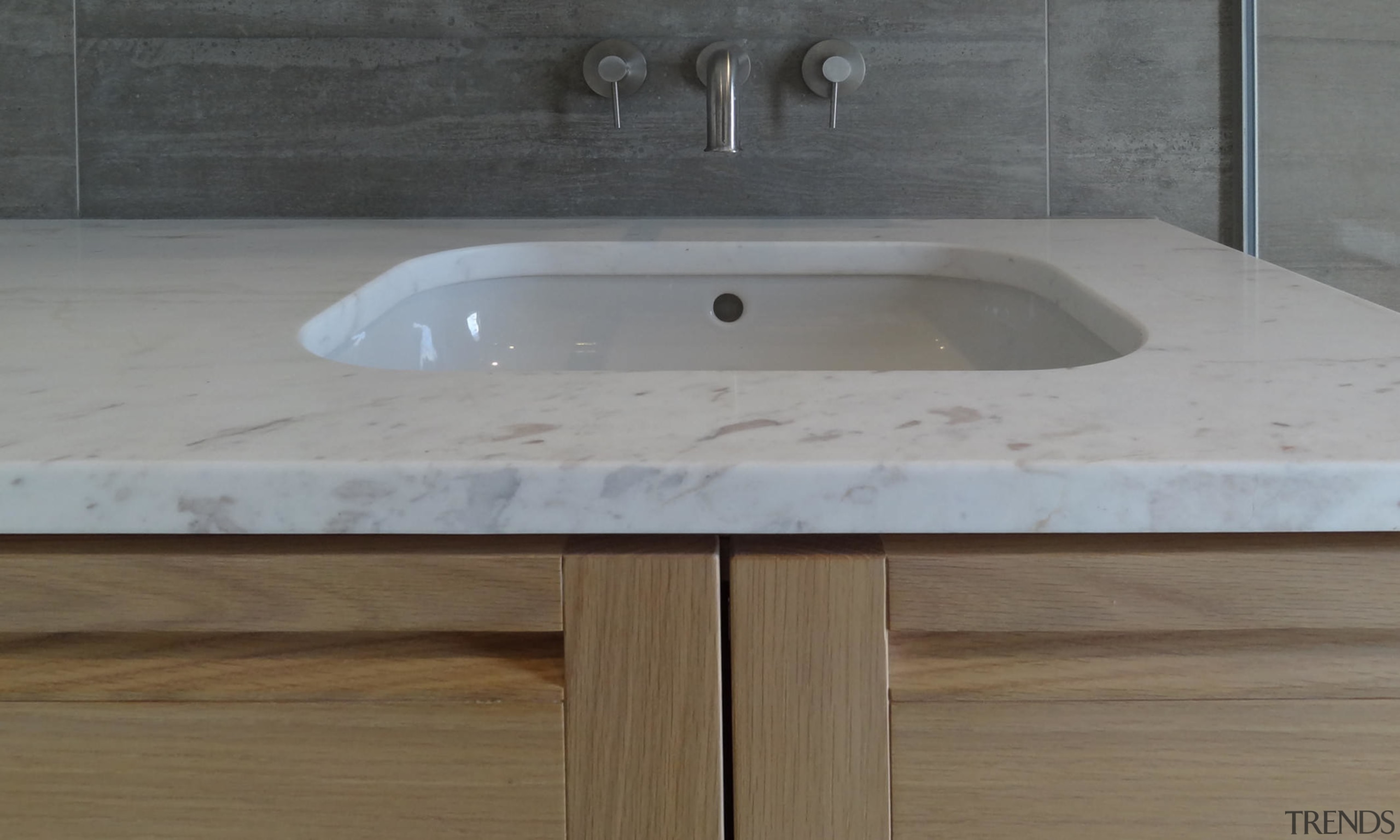 An industrial look is warmed up by soft bathroom sink, countertop, plumbing fixture, sink, gray, brown