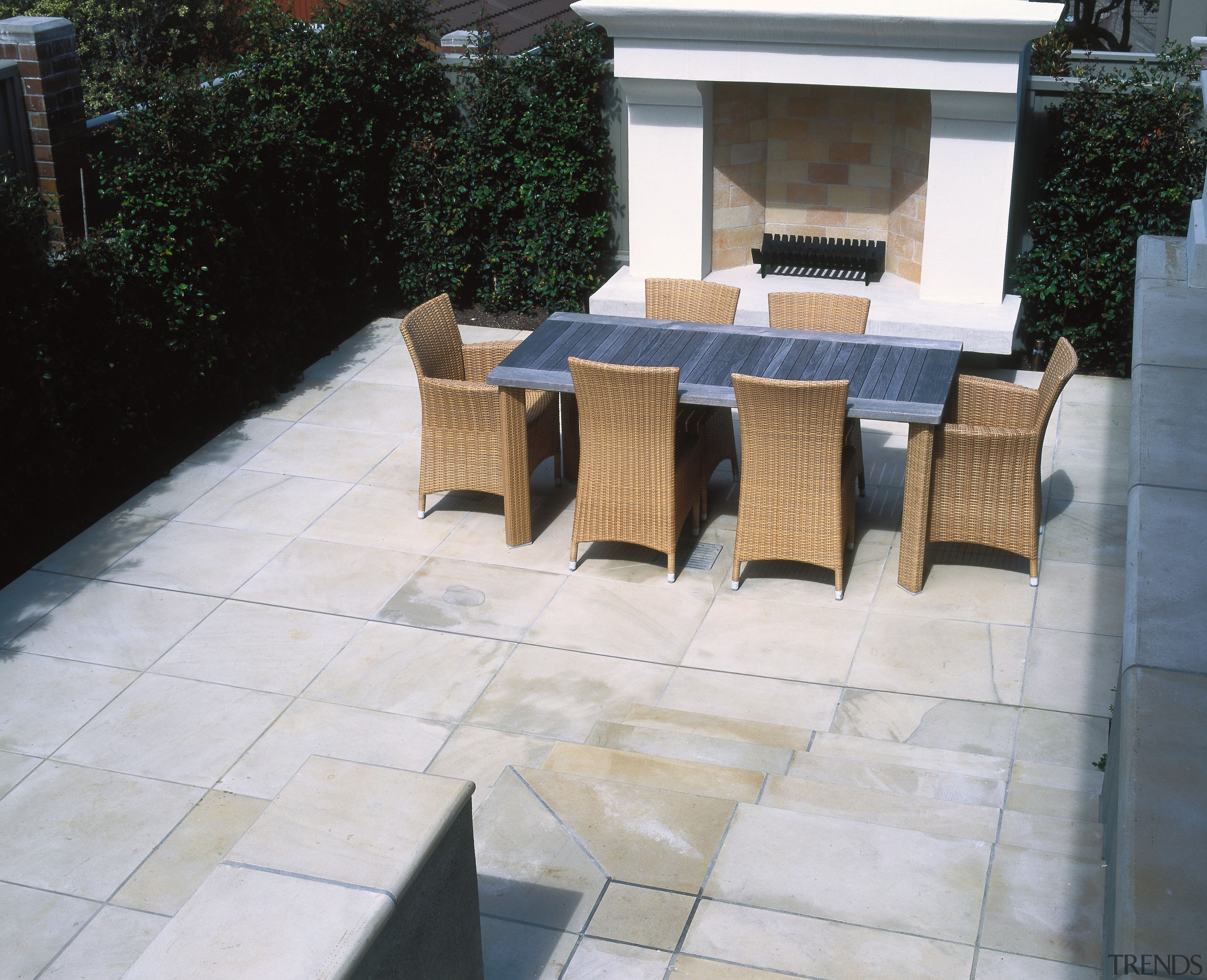 view of the outdoor dining and bbq area chair, floor, flooring, furniture, outdoor structure, patio, tile, wall, gray, black