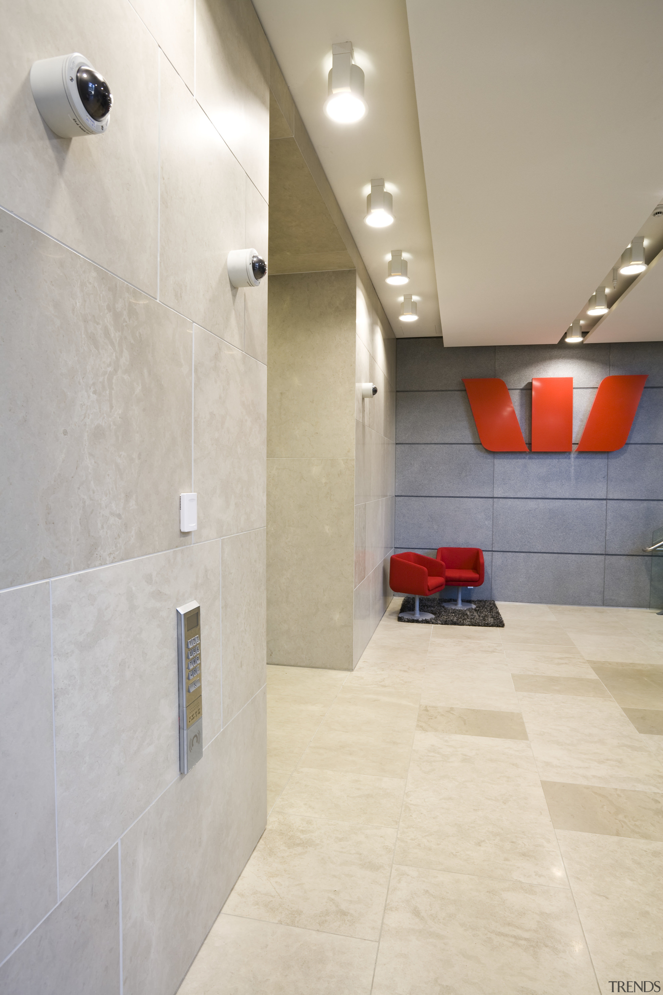 Interior view of the main foyer at the architecture, bathroom, ceiling, daylighting, floor, flooring, interior design, lighting, lobby, room, tile, wall, gray