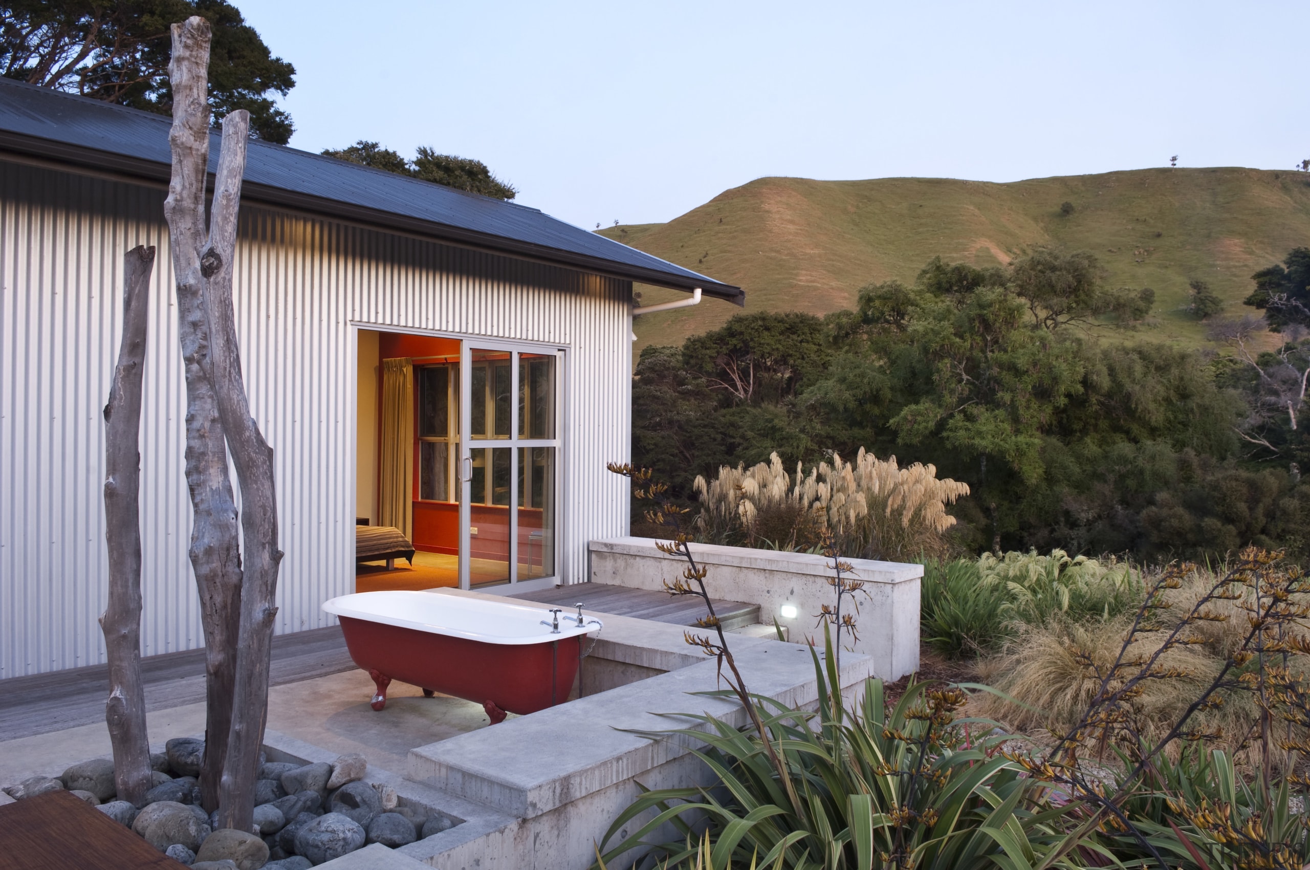 View of rural home with open plan lounge backyard, cottage, estate, home, house, landscape, outdoor structure, property, real estate, window, gray