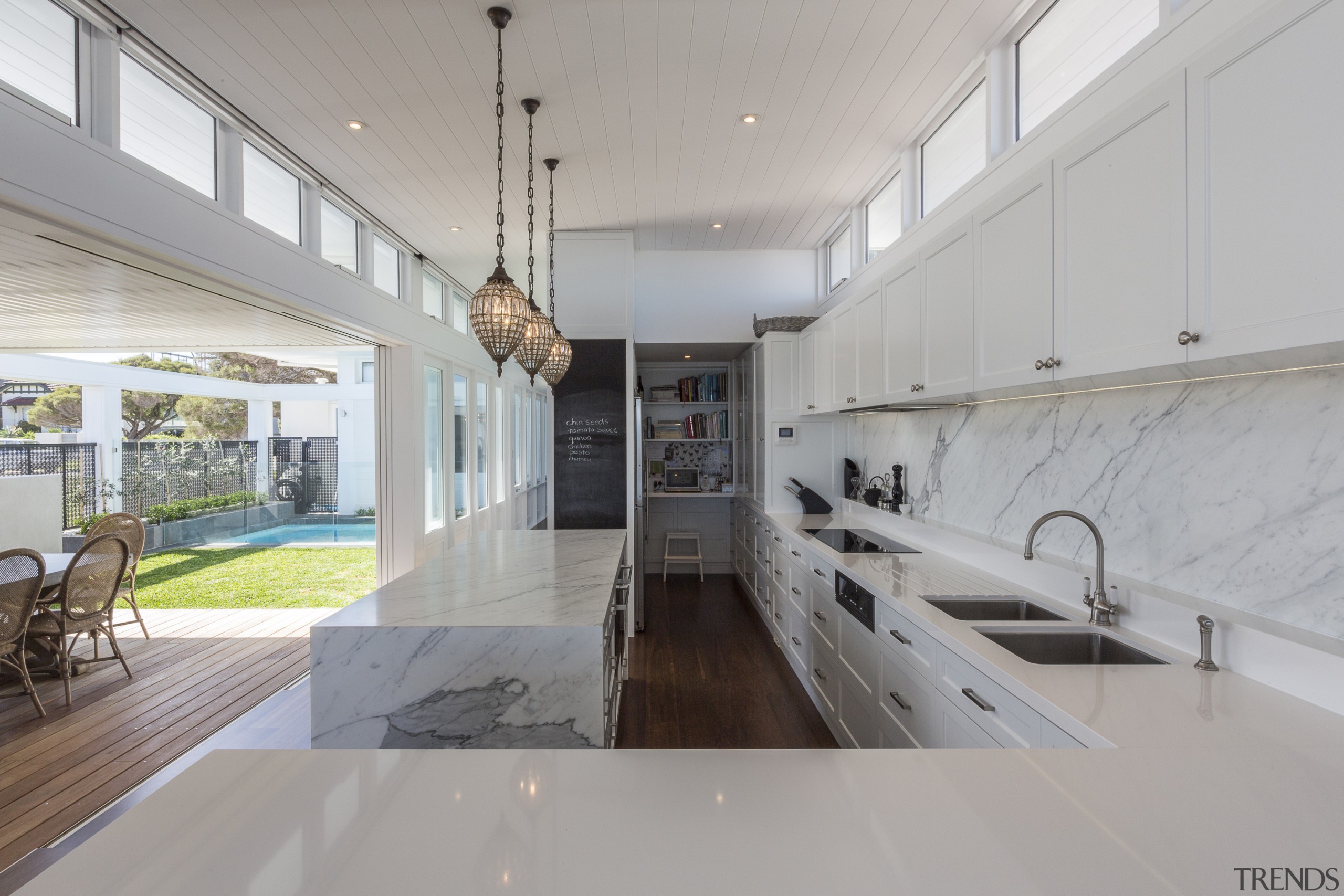 The kitchen and living area in this new architecture, countertop, house, interior design, real estate, gray