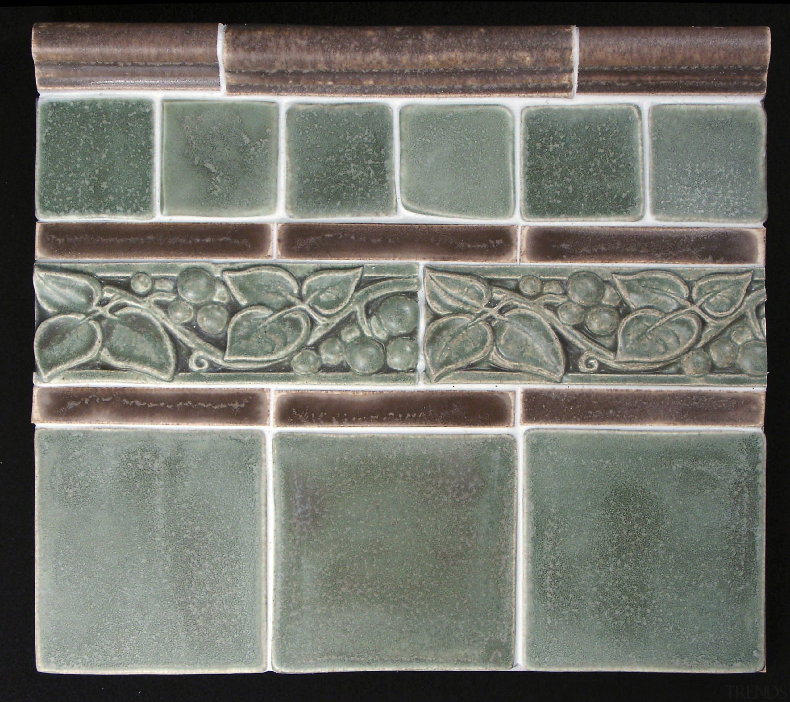 Image of an intricate tile design by Timeless glass, wall, gray