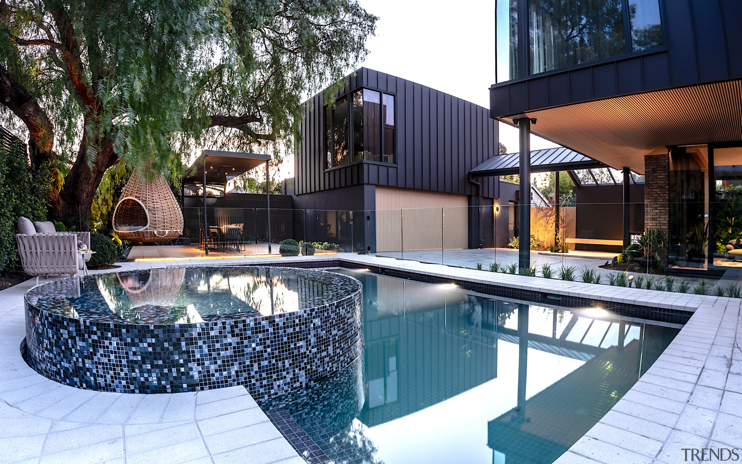 The pool and landscape design takes cues from 
