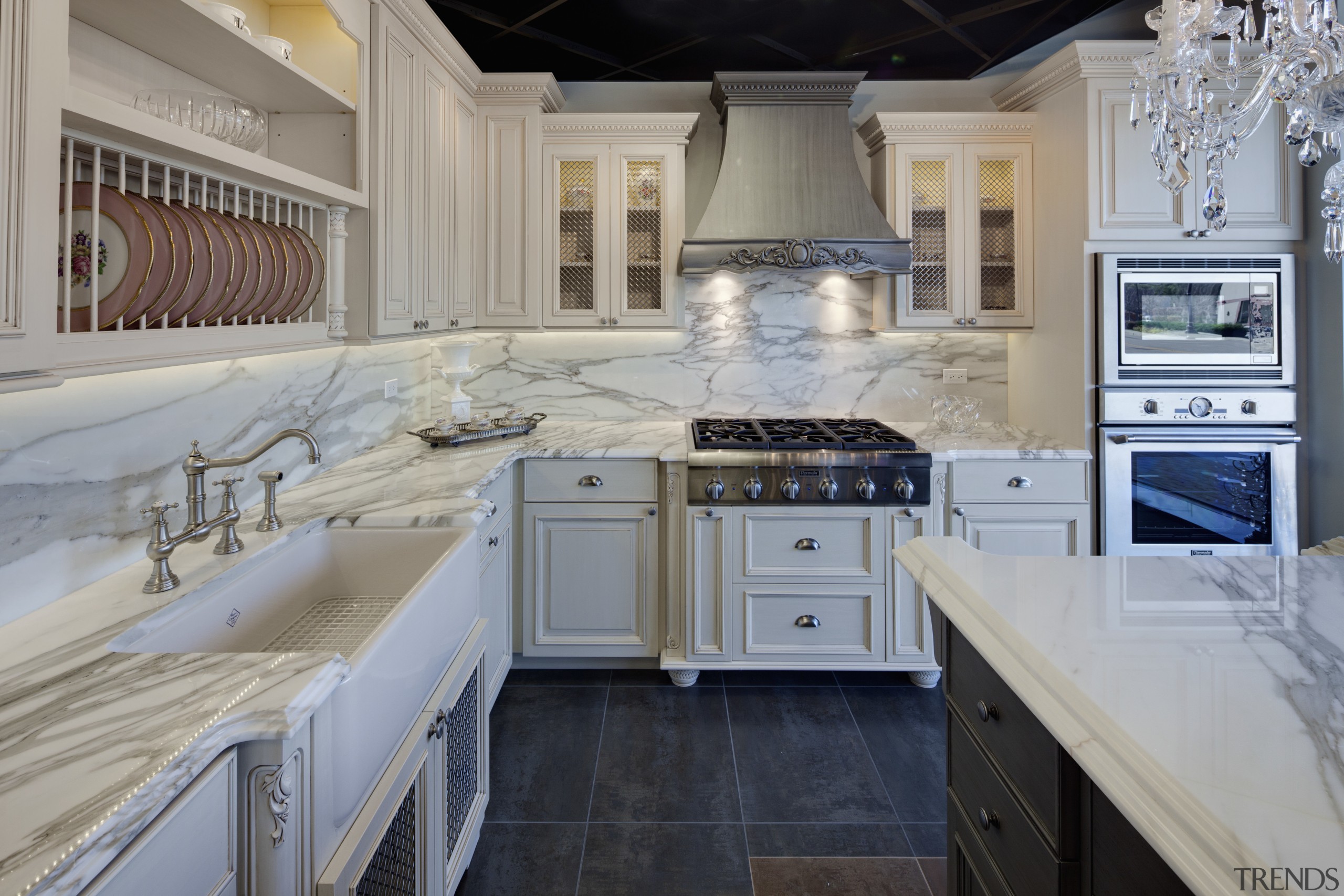 View of a traditional styled kitchen which features cabinetry, countertop, cuisine classique, floor, interior design, kitchen, room, gray