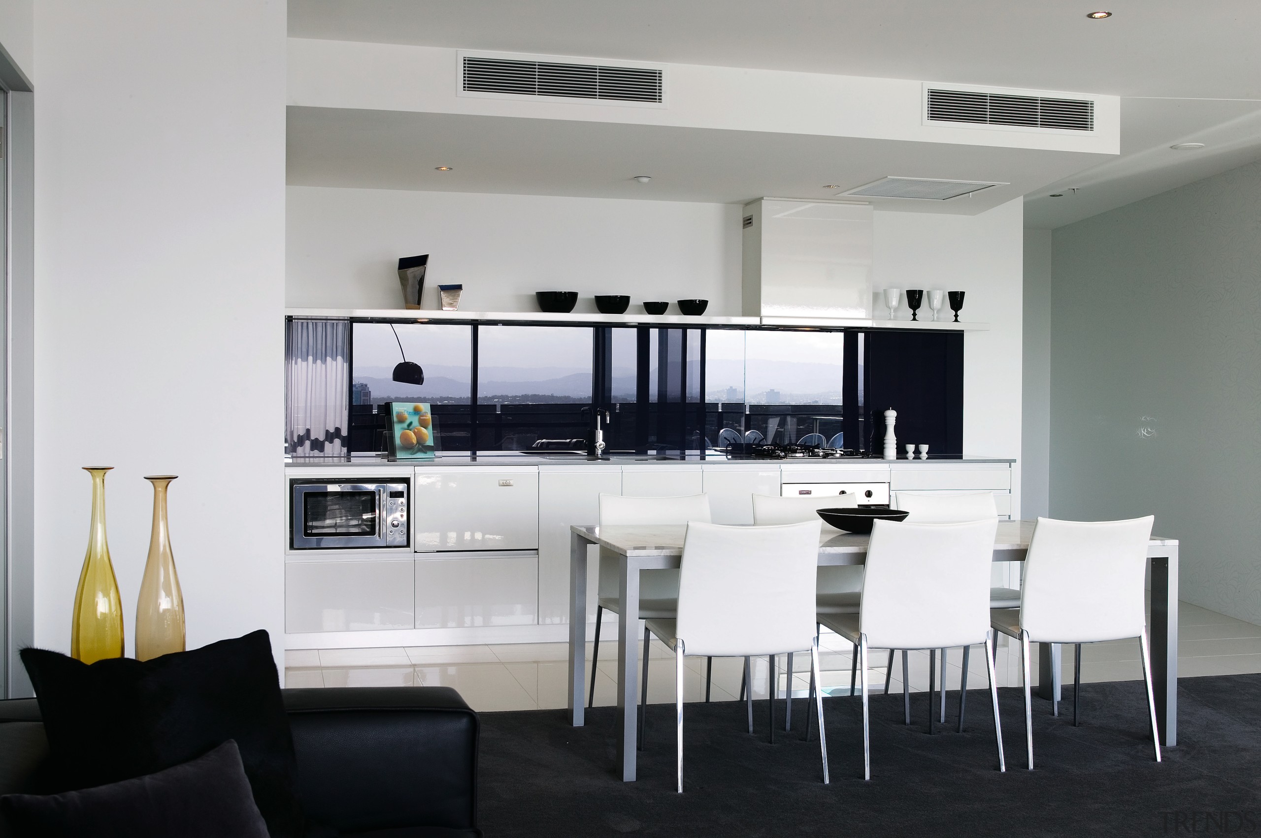 A view of this kitchen featuring the latest furniture, interior design, kitchen, real estate, table, gray, white