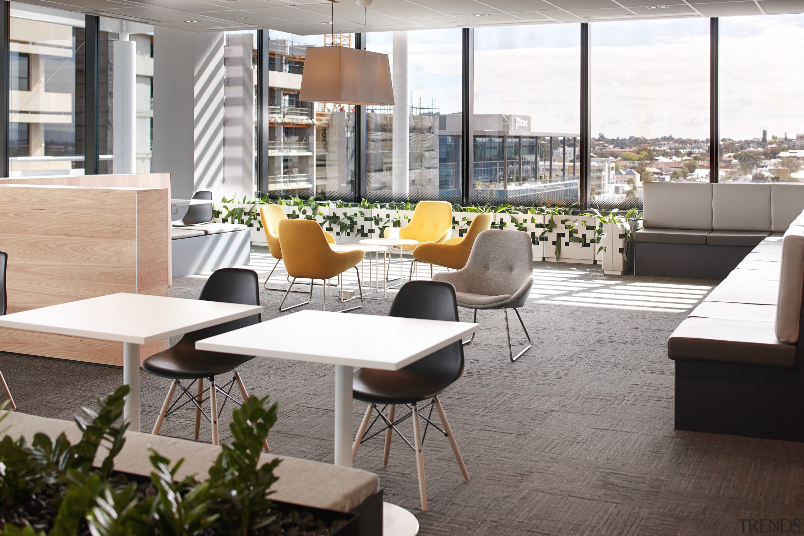 The large stairway void, centrally located hubs and chair, furniture, interior design, table, white, gray