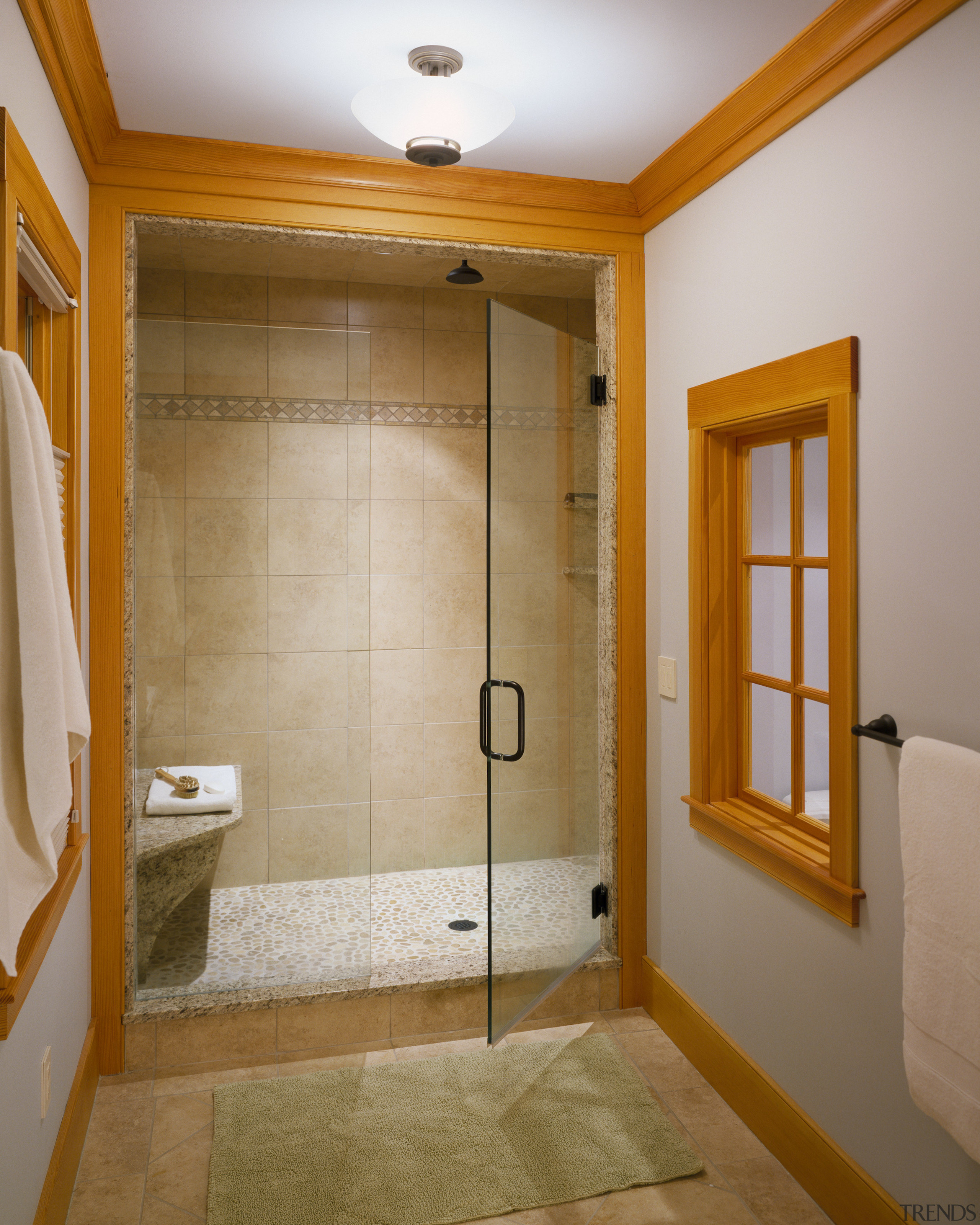 View of shower area with tiled floors, wooden bathroom, ceiling, door, floor, flooring, home, interior design, plumbing fixture, real estate, room, tile, wall, brown, gray