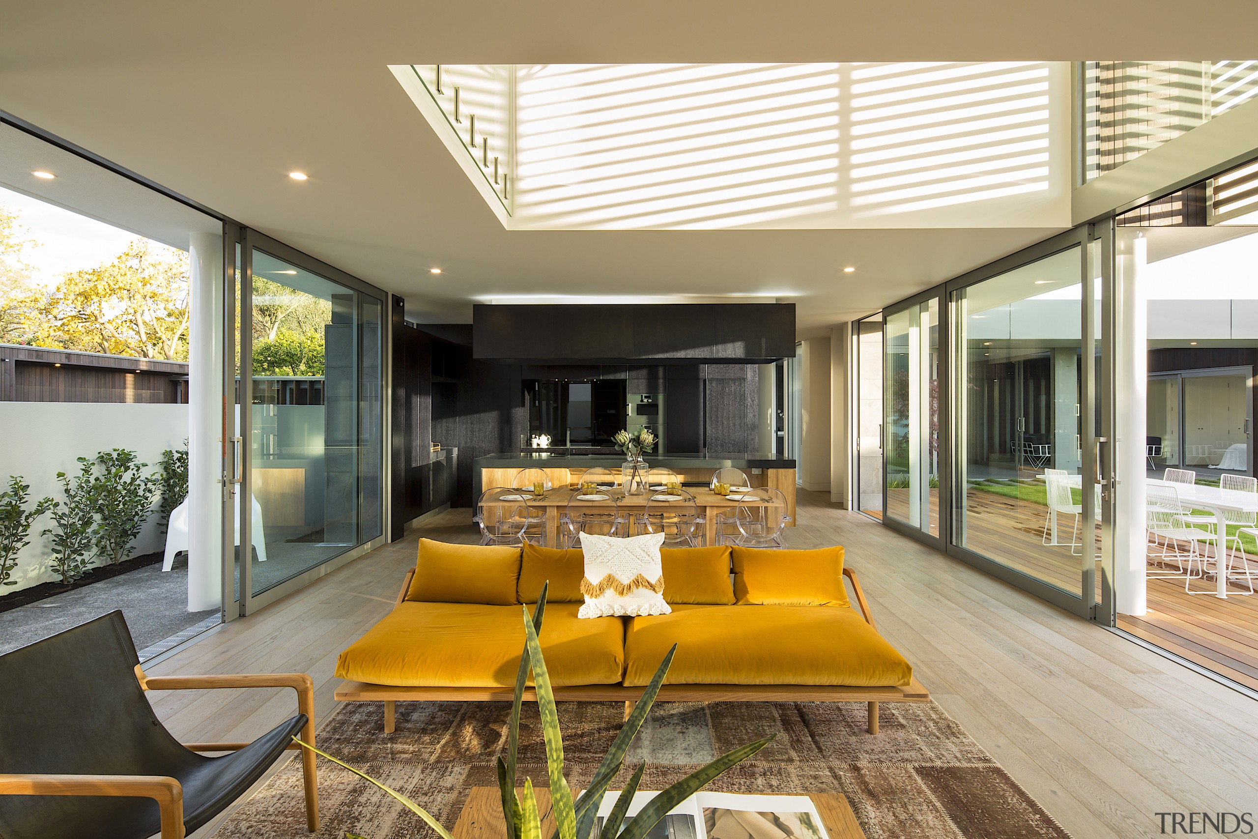 The living area has large opening doors east 