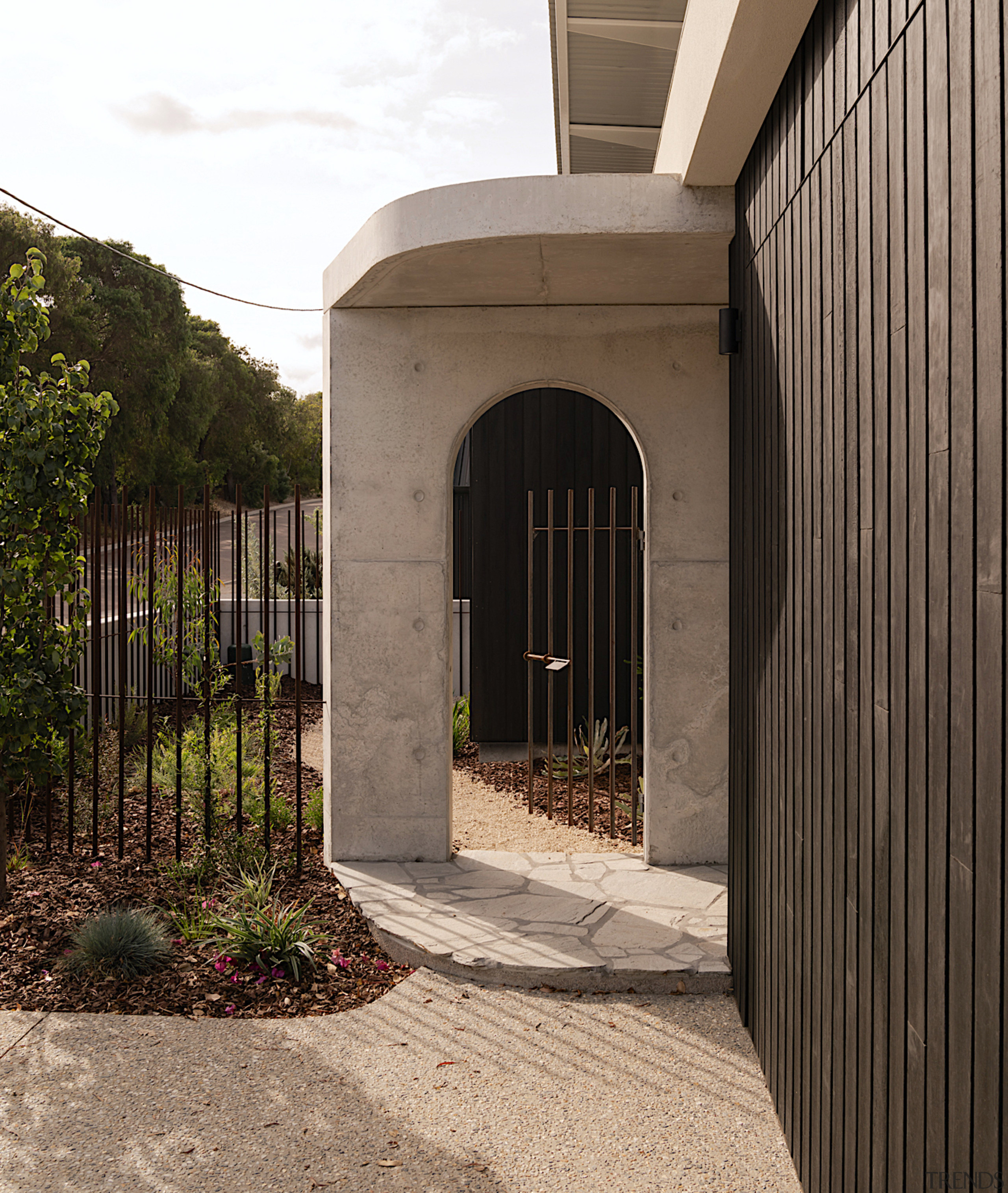 Concrete arch gated entry. - Enduring aesthetic - 