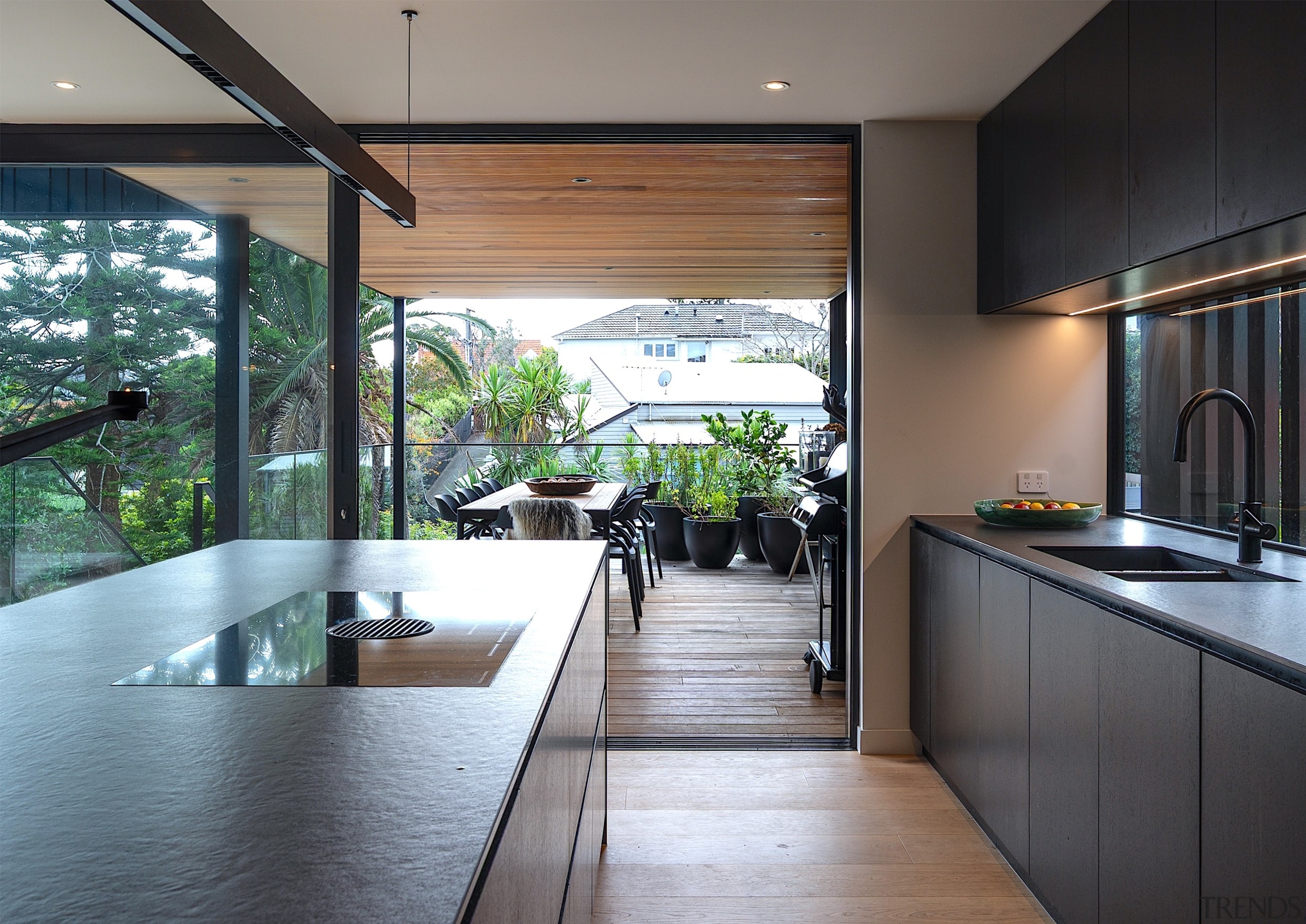 Looking from kitchen to mid-level deck. An induction 