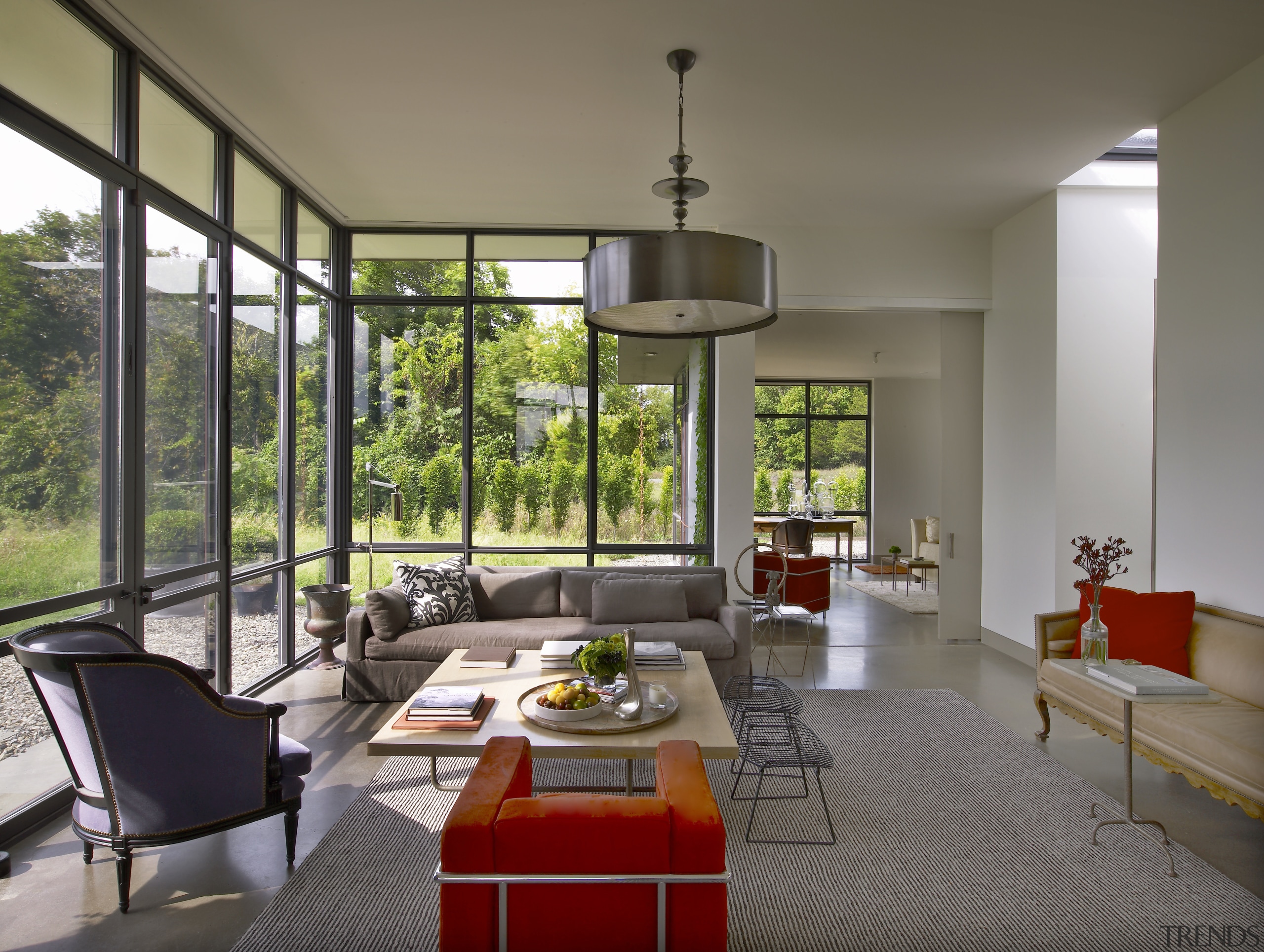 The central living area in this house is architecture, house, interior design, living room, real estate, window, gray