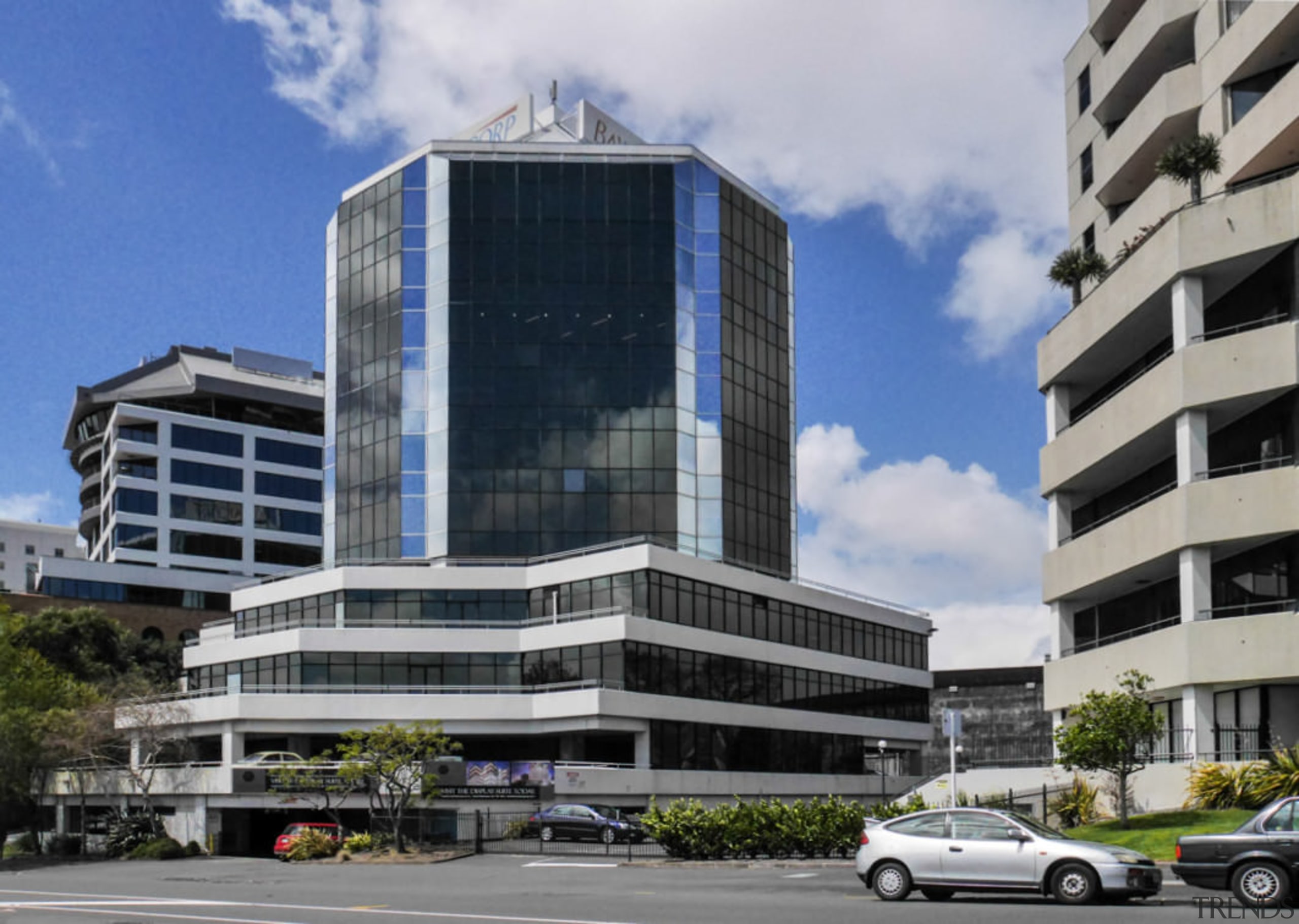 The hexagonal 1980s Chase Building office tower was architecture, building, city, commercial building, condominium, corporate headquarters, daytime, downtown, facade, headquarters, metropolis, metropolitan area, mixed use, real estate, sky, skyscraper, tower block, gray, black