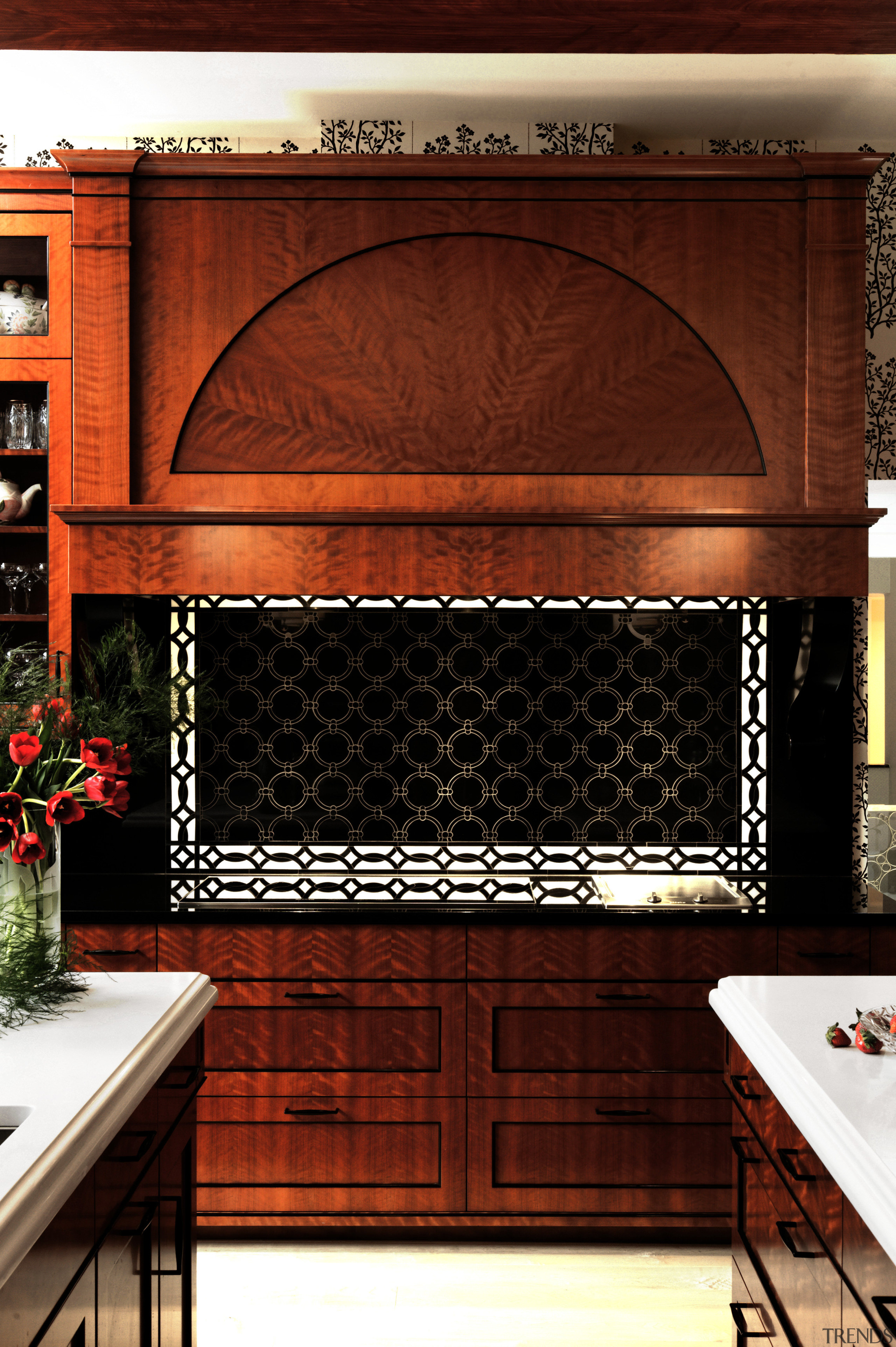 A sunburst pattern created by piecing together wood cabinetry, fireplace, furniture, hearth, interior design, wall, wood stain, red