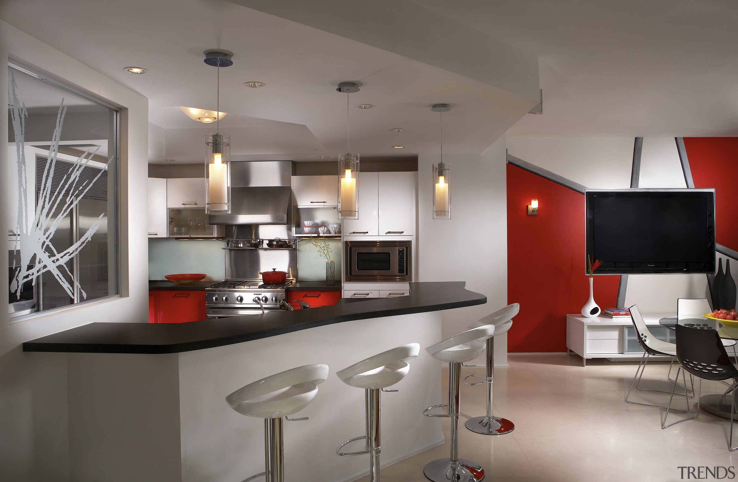 Interior view of contemporary apartment with red feature countertop, interior design, kitchen, real estate, gray