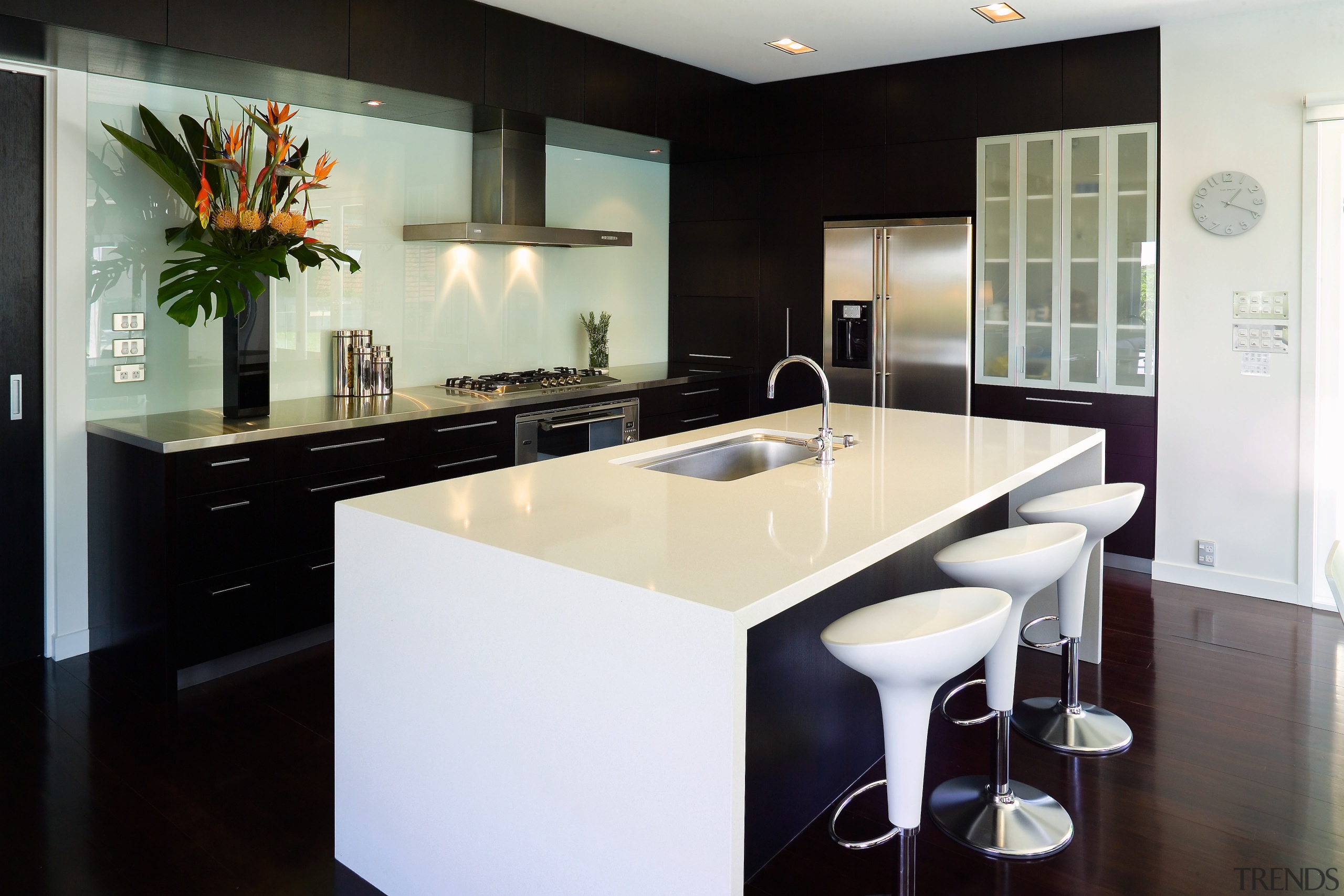 The deep island has enough bench space for cabinetry, countertop, interior design, kitchen, real estate, room, black, white