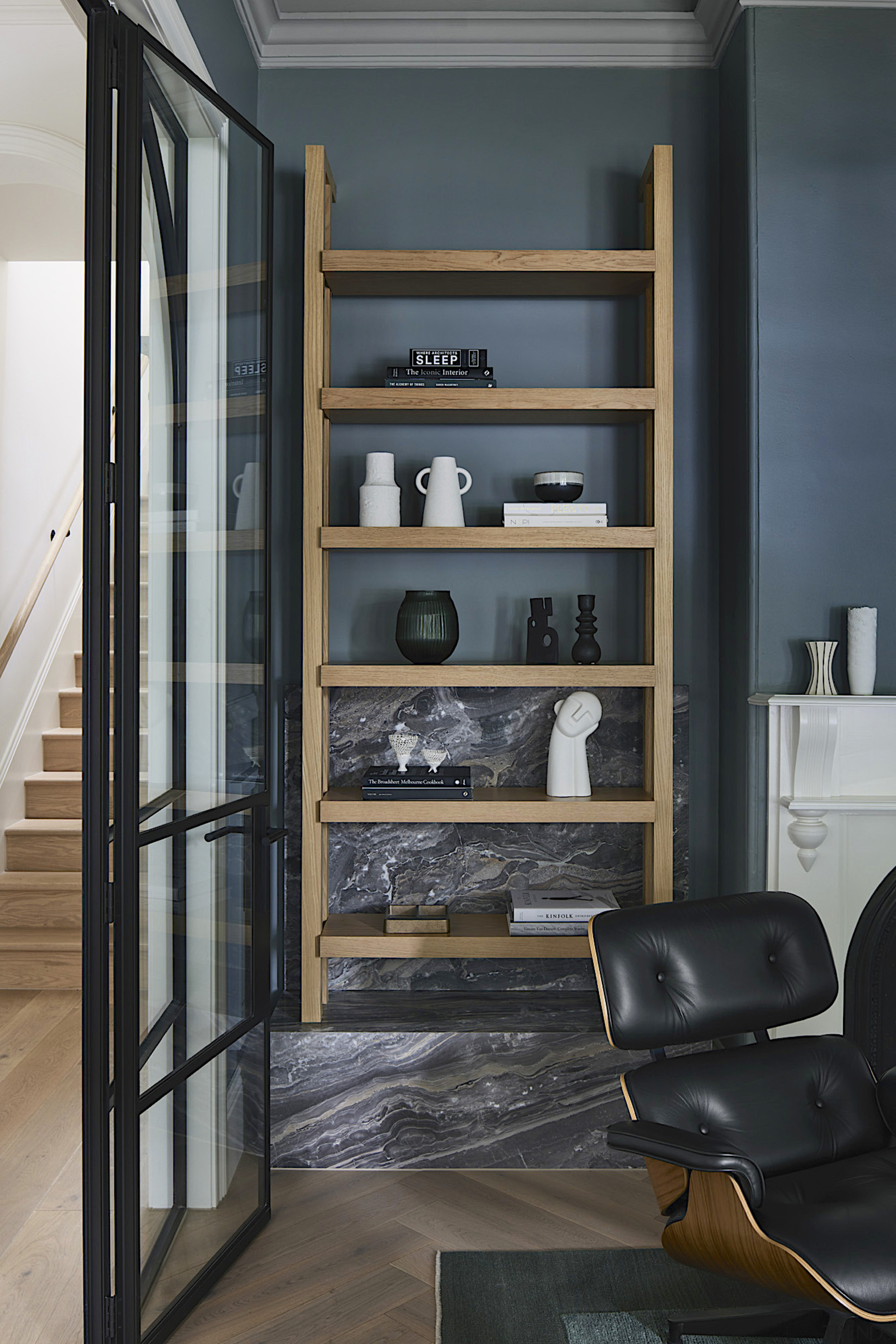 Open display storage on a stone plinth adds 