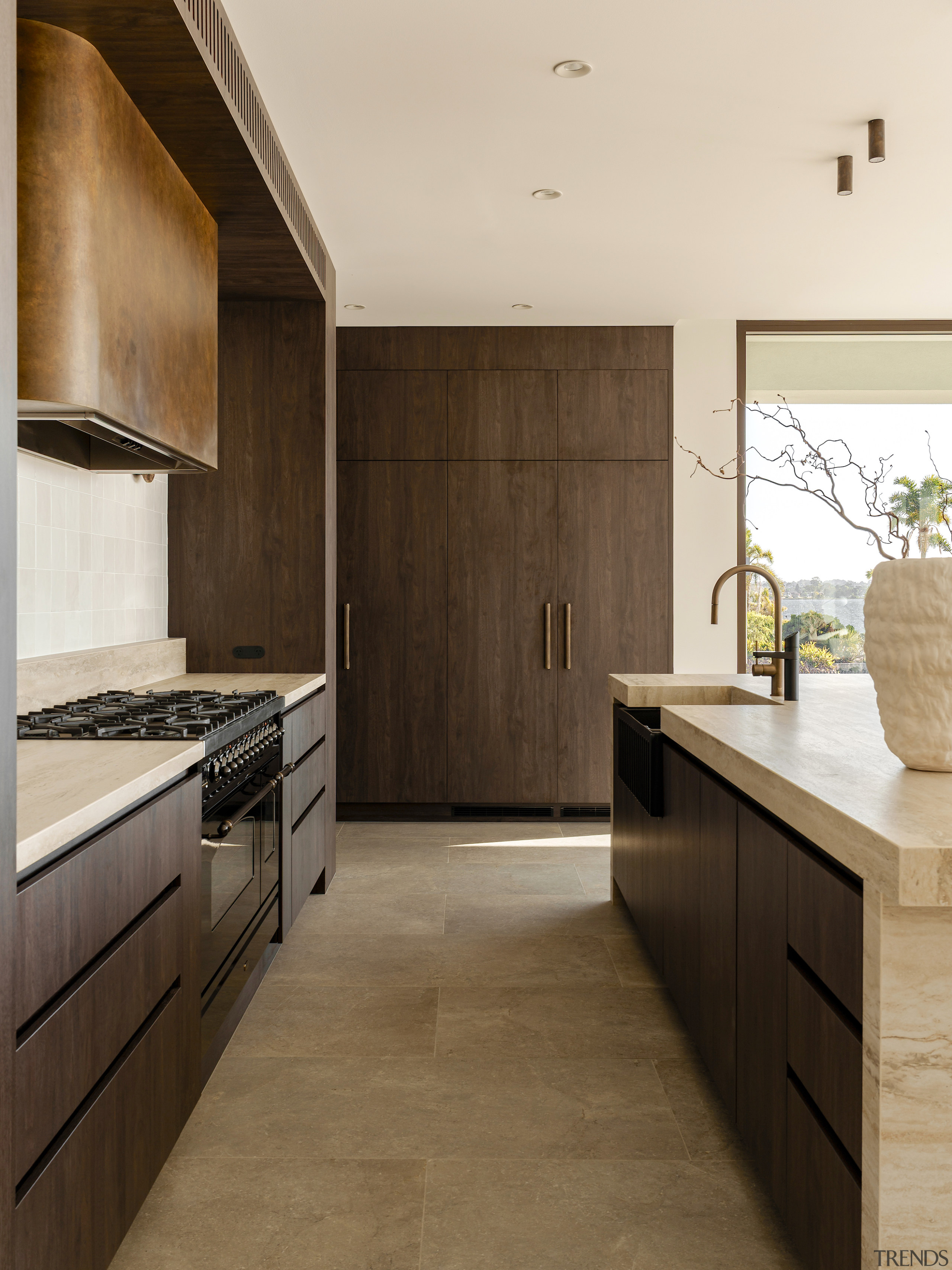 The cabinetry's handle-free construction creates a modern feel 