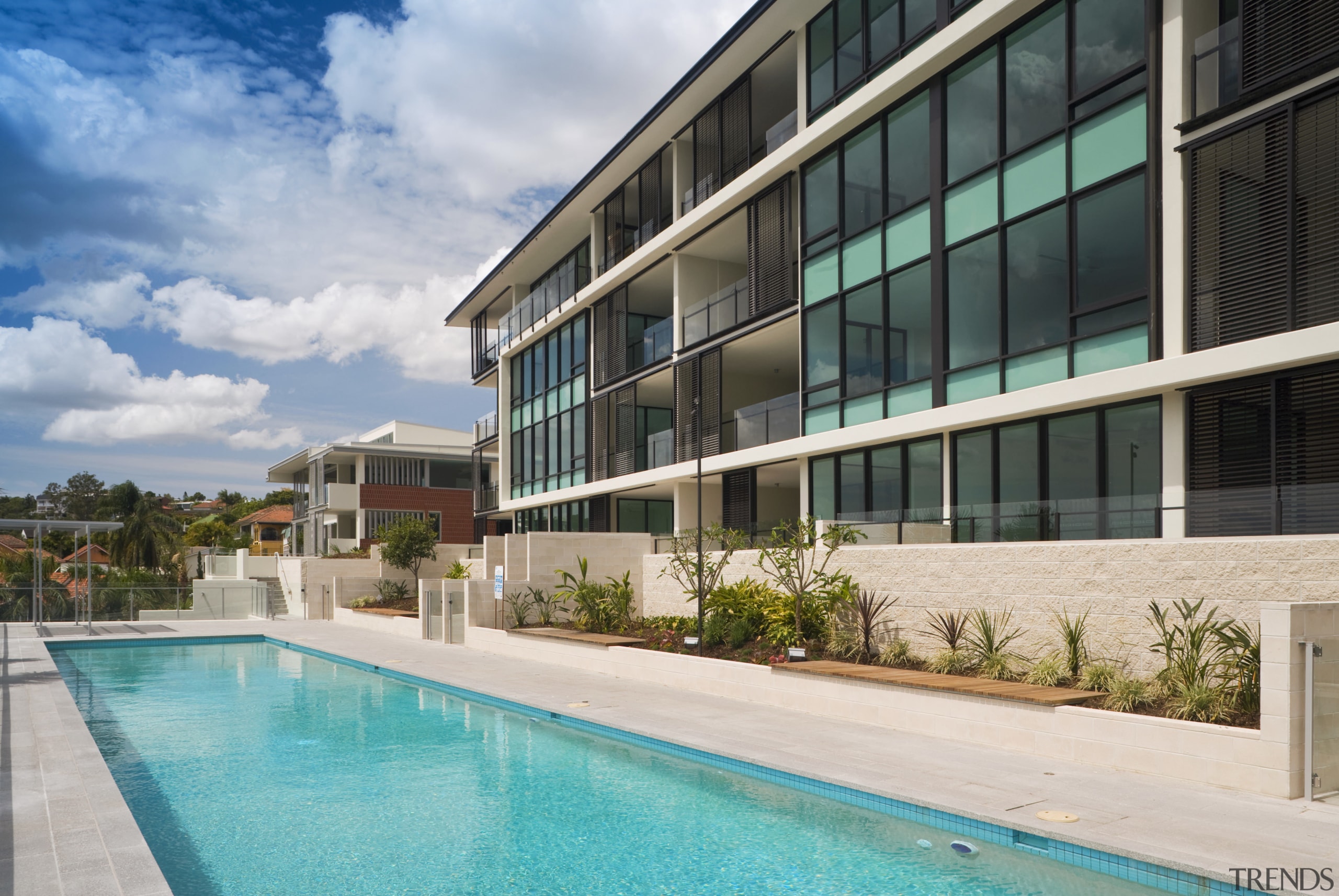 View of the Norman Reach development which is apartment, building, condominium, estate, home, house, leisure, property, real estate, residential area, resort, swimming pool, villa, teal