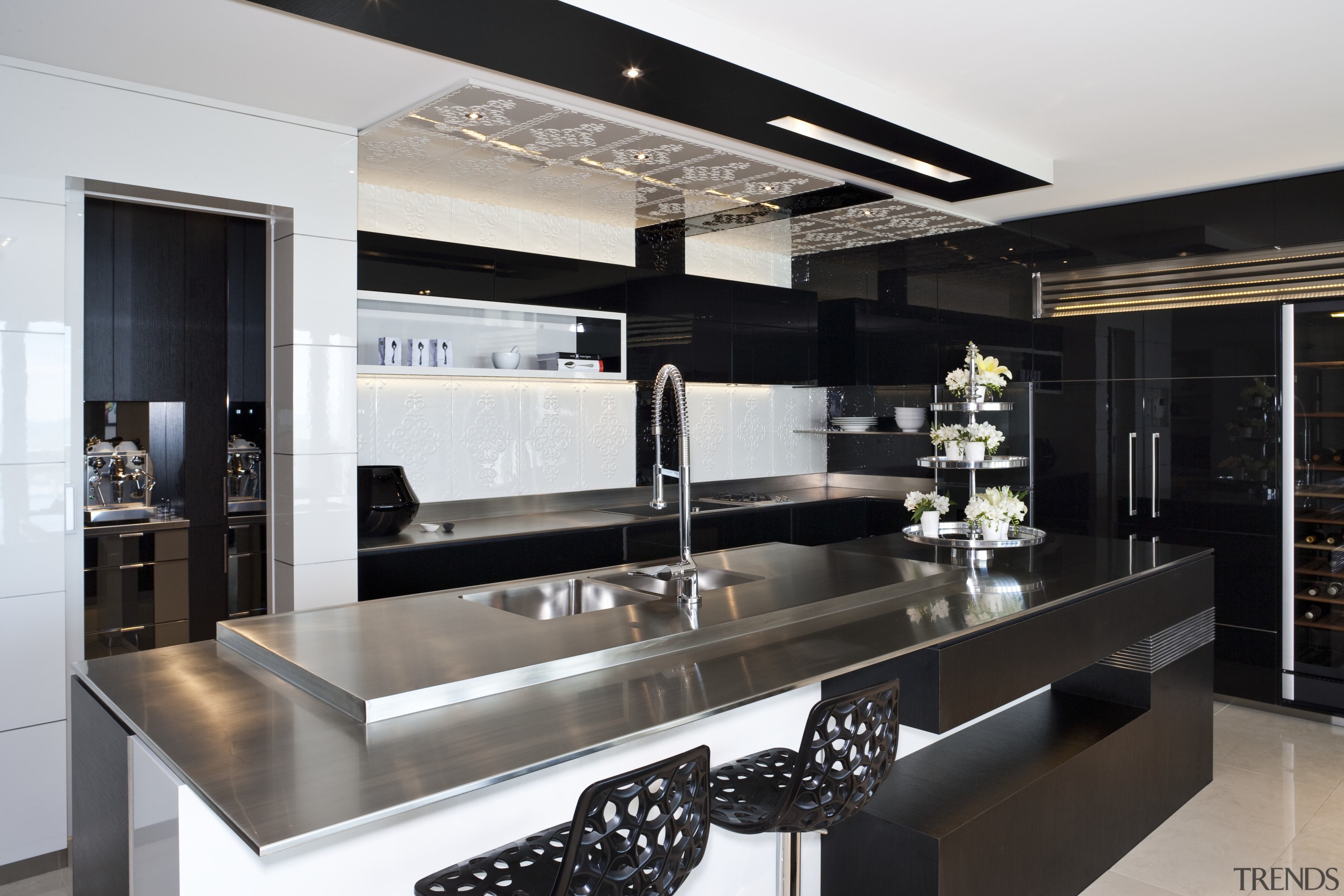 View of this modern kitchen featuring black as countertop, interior design, kitchen, black, gray