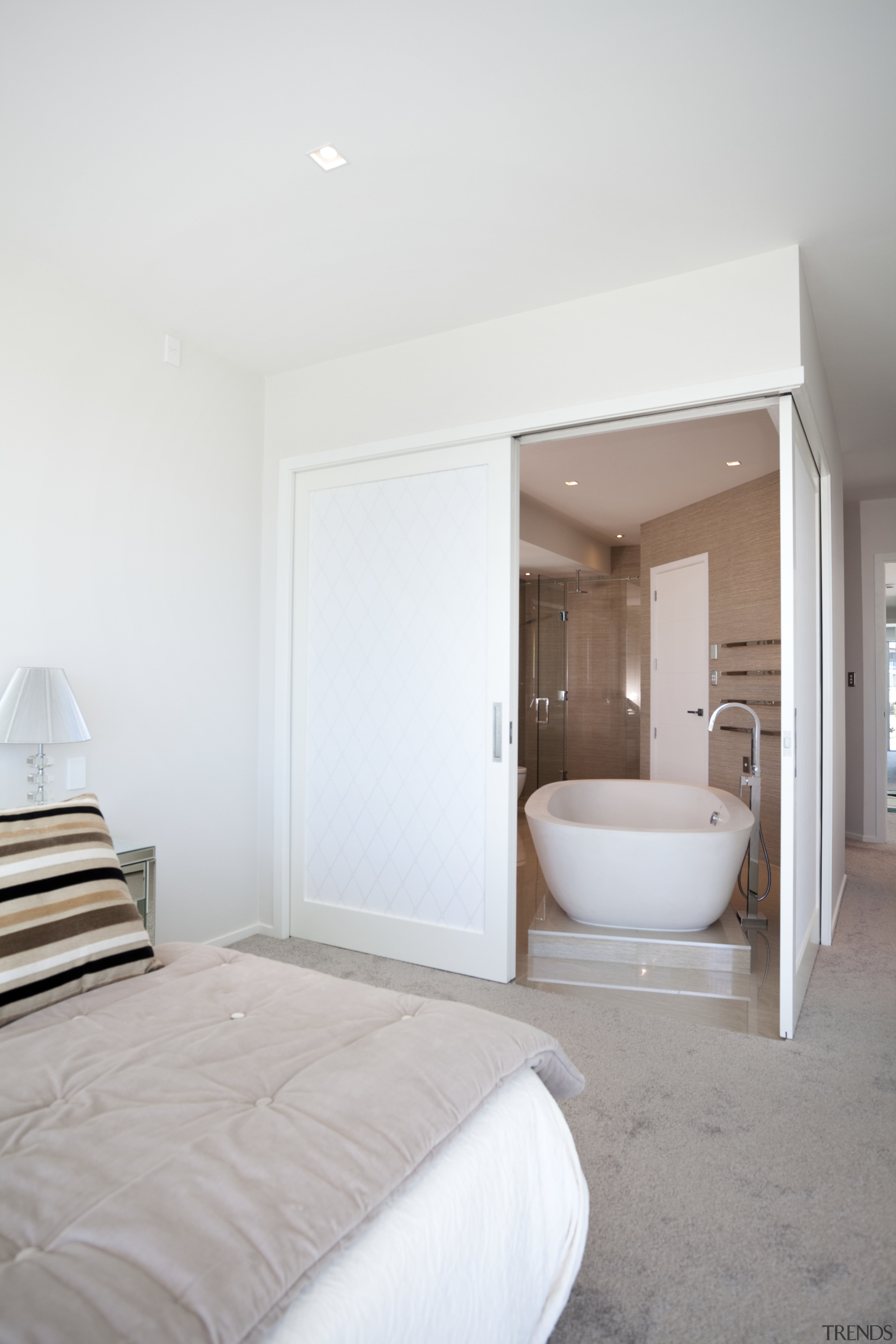 Bedroom with grey carpeting and ensuite with large architecture, bedroom, ceiling, floor, home, interior design, real estate, room, suite, white, gray