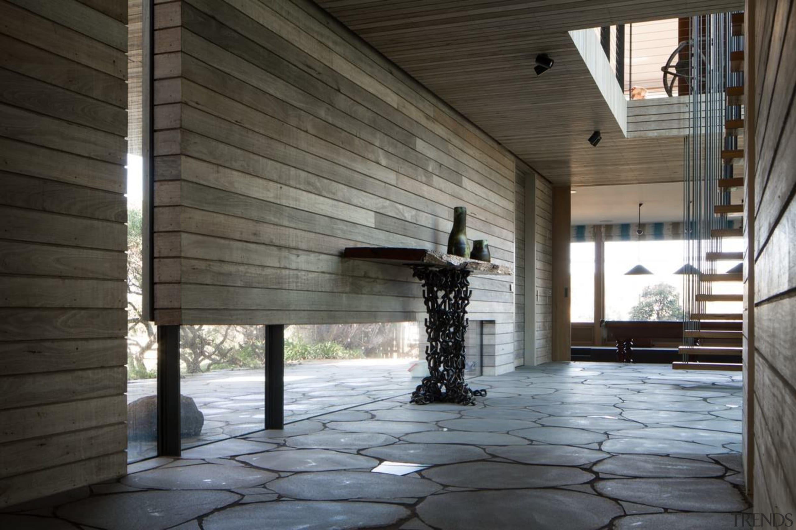 Windows running along the floor keep the hallway architecture, daylighting, floor, house, interior design, structure, wood, black, gray