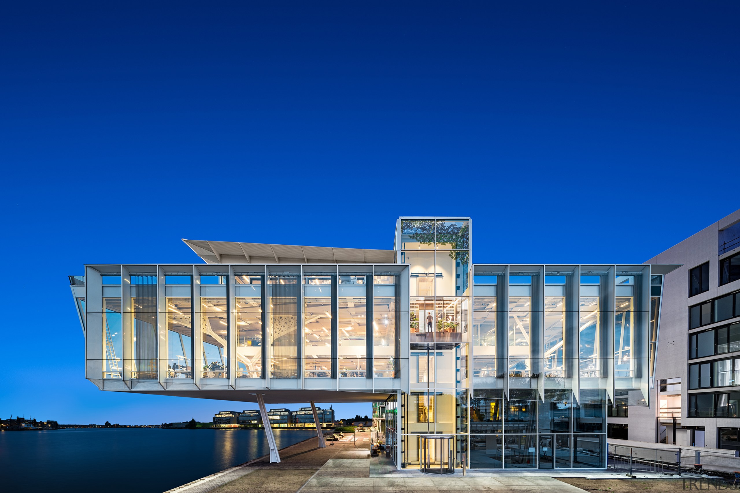 Exterior view of Amvest headquarters. At the heart architecture, blue, building, city, commercial building, corporate headquarters, facade, headquarters, home, house, mixed-use, real estate, sky, urban design, blue