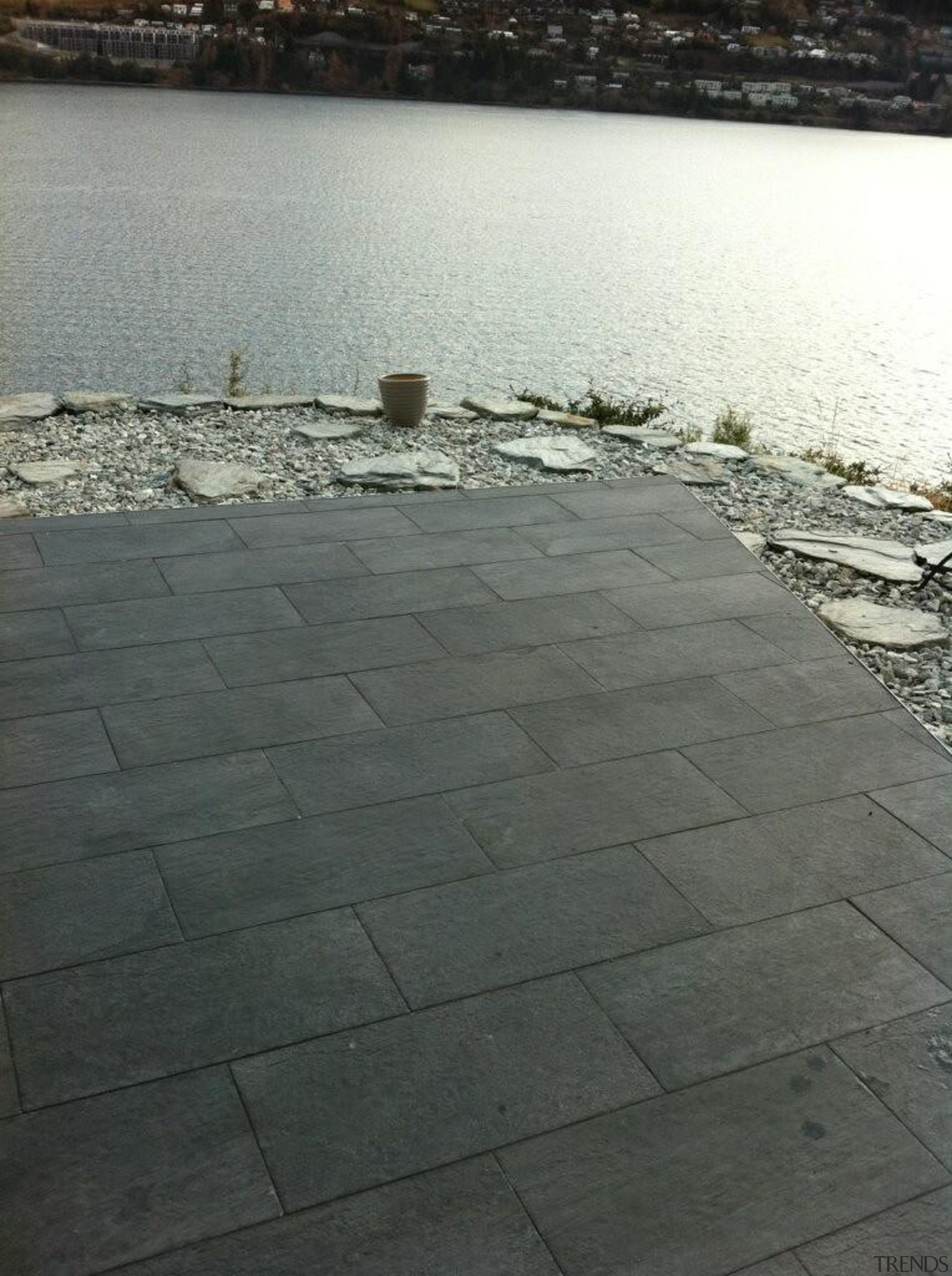 Stone D graphite exterior patio floor tiles - floor, road surface, sky, walkway, wall, water, gray, black