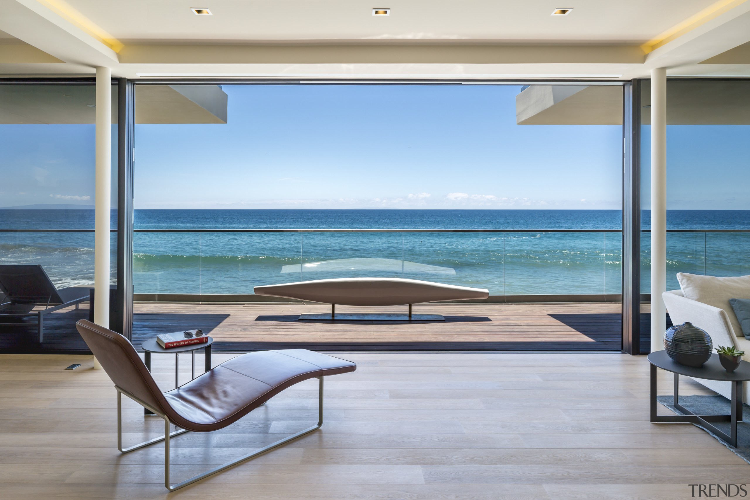 Expansive glass panels at the front of this condominium, estate, house, interior design, ocean, real estate, resort, sea, vacation, wall, window, gray, teal