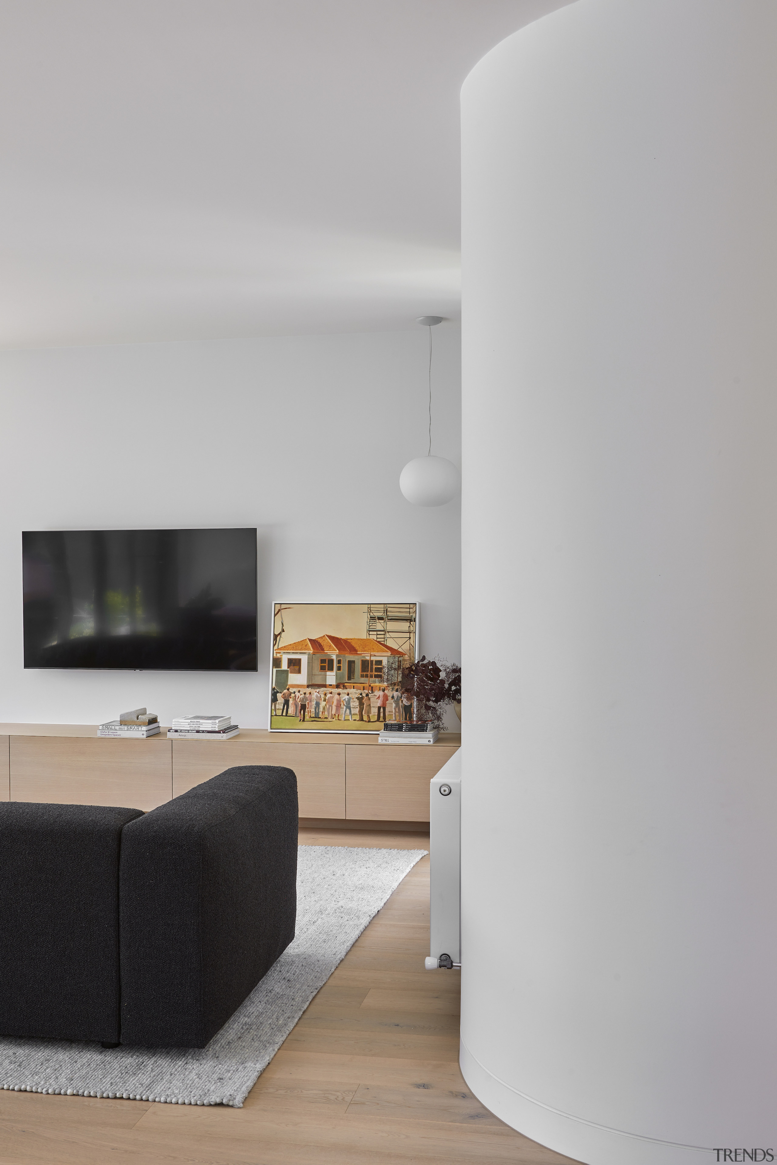 Curved walls gently lead into the north-facing living 