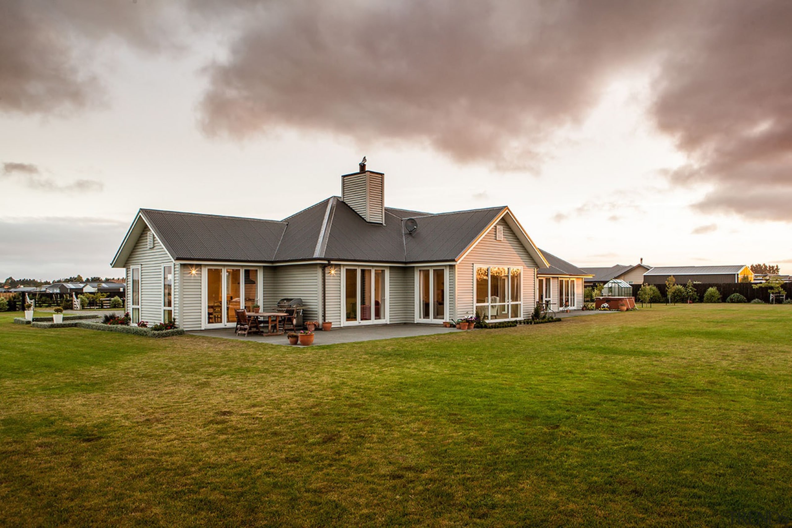 Set in a superb new Canterbury subdivision this cloud, cottage, estate, farm, farmhouse, grass, home, house, landscape, property, real estate, residential area, roof, rural area, sky, suburb, brown, white