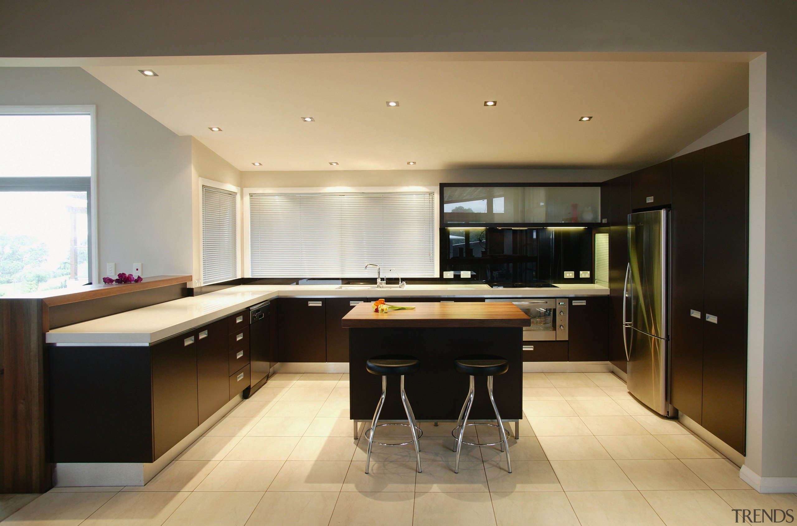 Kitchen with dark brown cabinetry, white benchtops, timber cabinetry, countertop, floor, flooring, interior design, kitchen, real estate, room