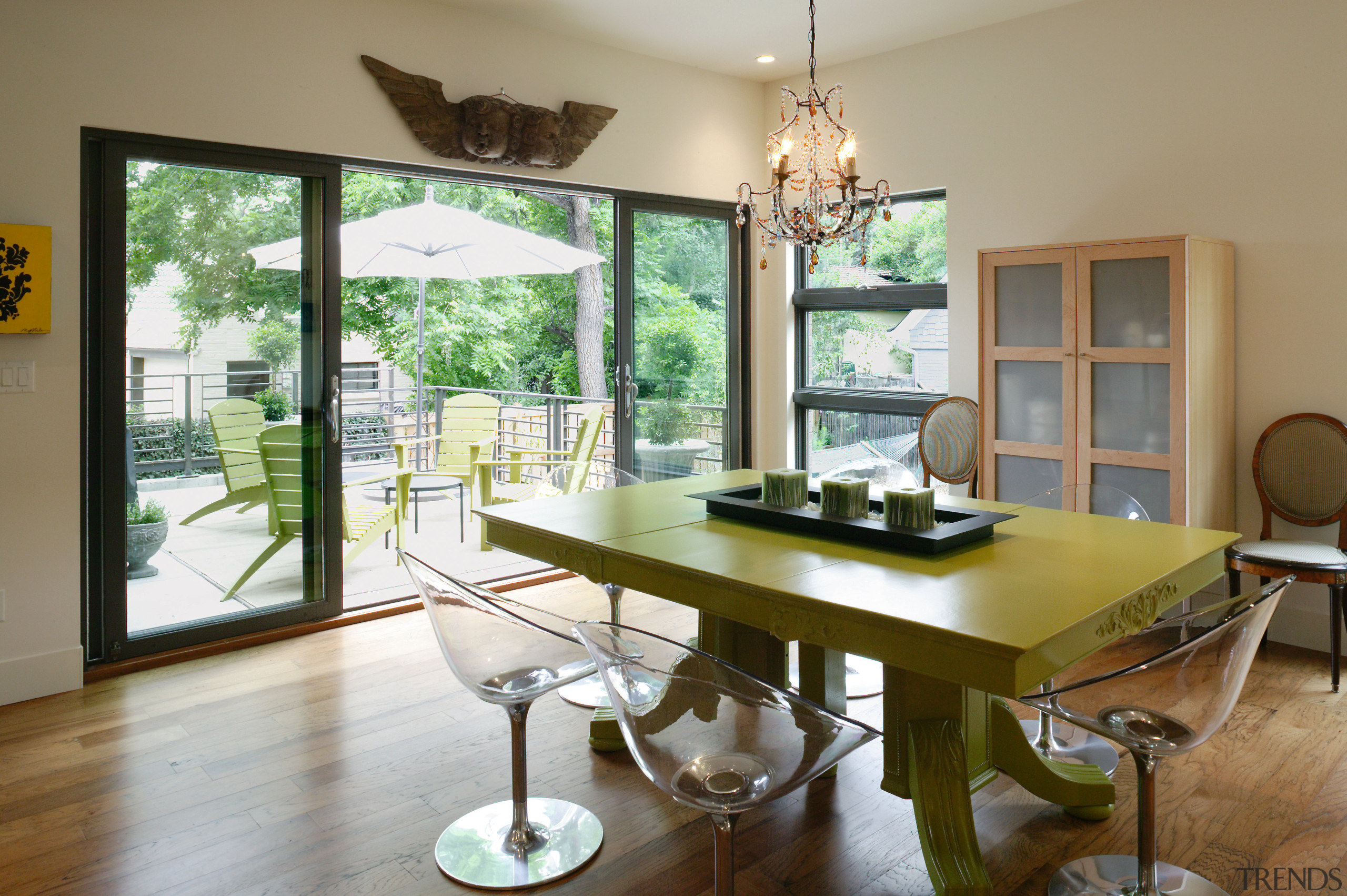 A view of the dining area featuring varnished dining room, furniture, home, house, interior design, living room, real estate, room, table, window, brown, gray