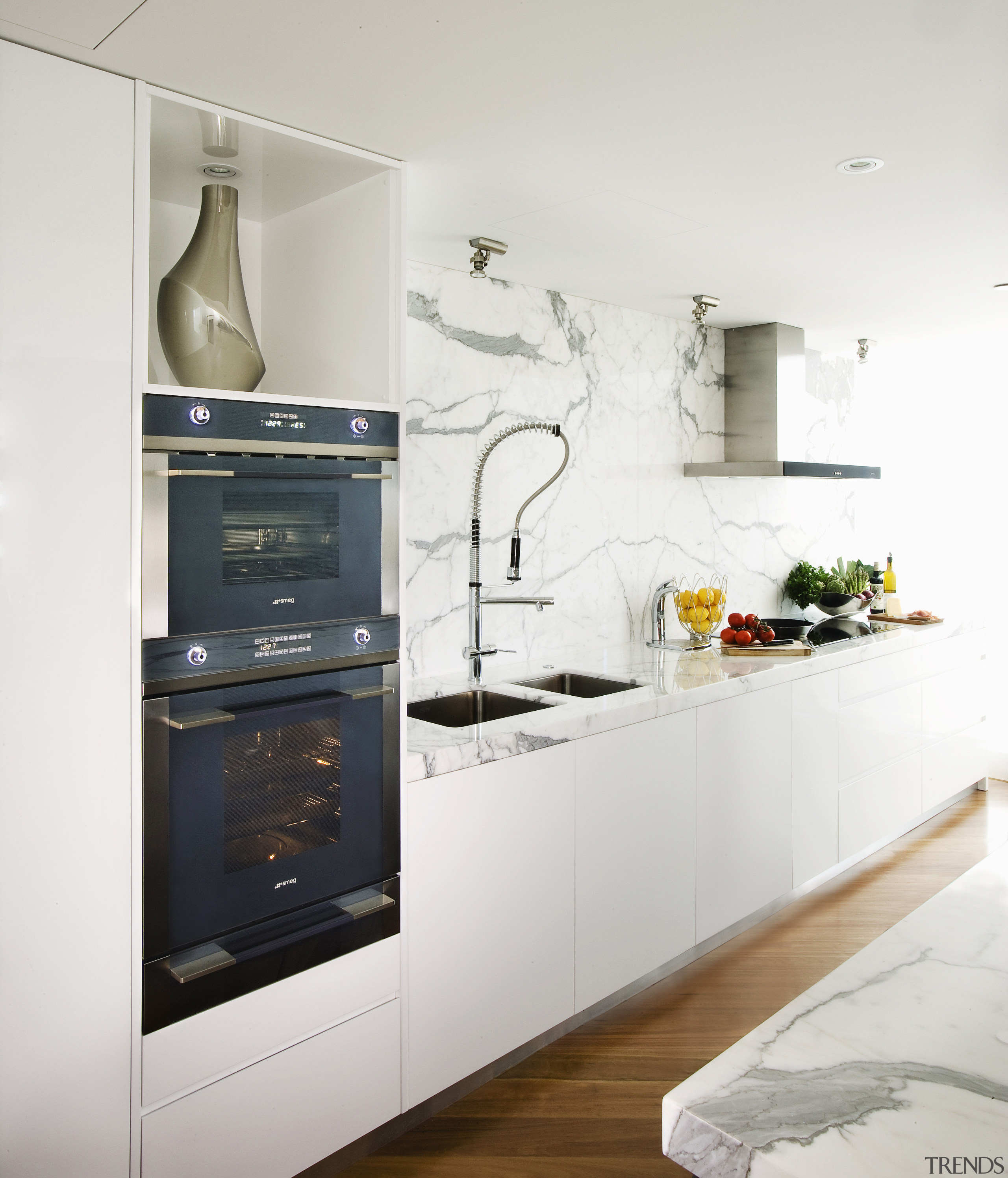 View of contemporary kitchen with white cabinetry. countertop, cuisine classique, home appliance, interior design, kitchen, kitchen appliance, kitchen stove, major appliance, refrigerator, white